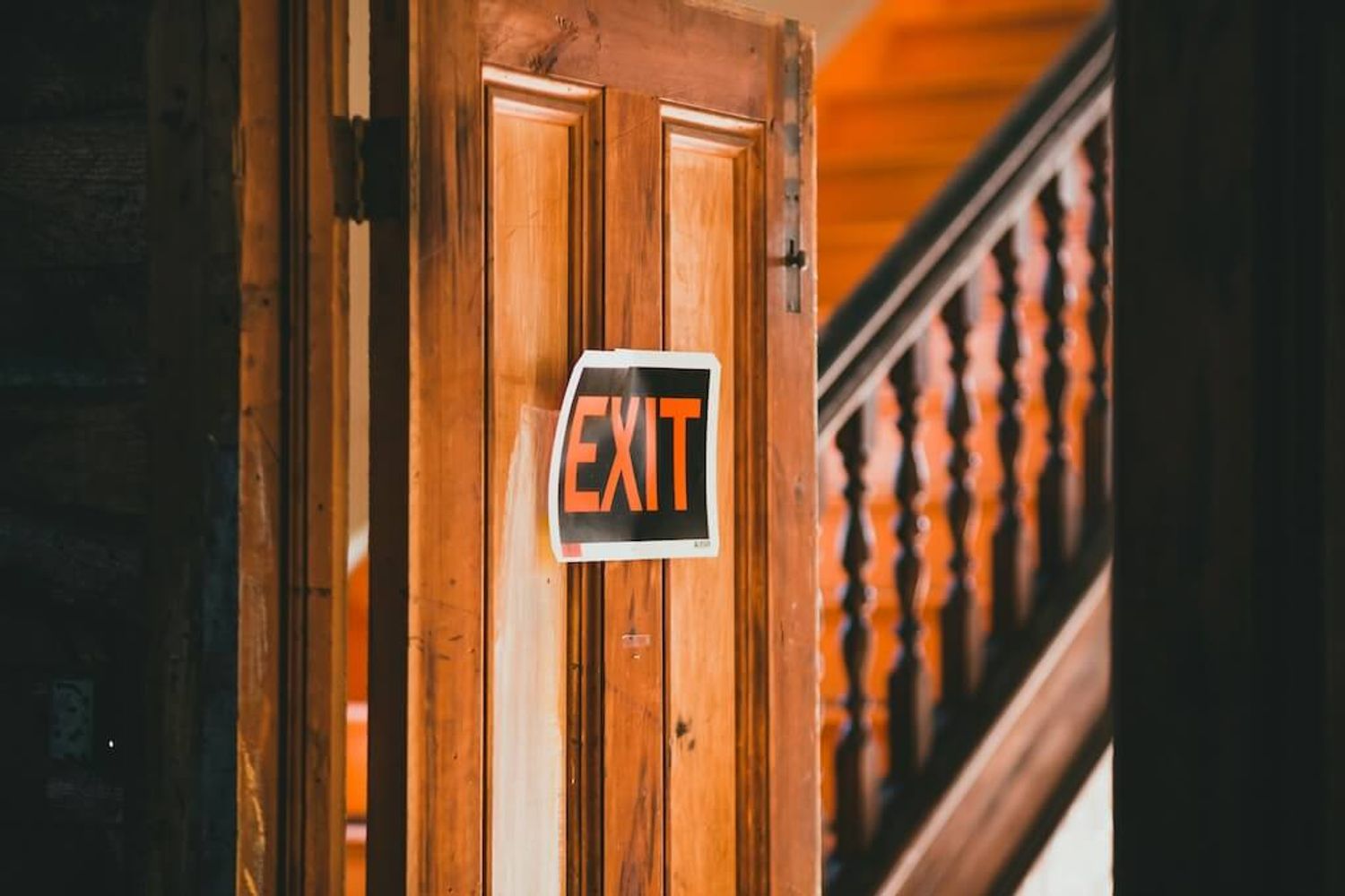 Exit sign symbolizing a strategic startup exit path for founders seeking success.