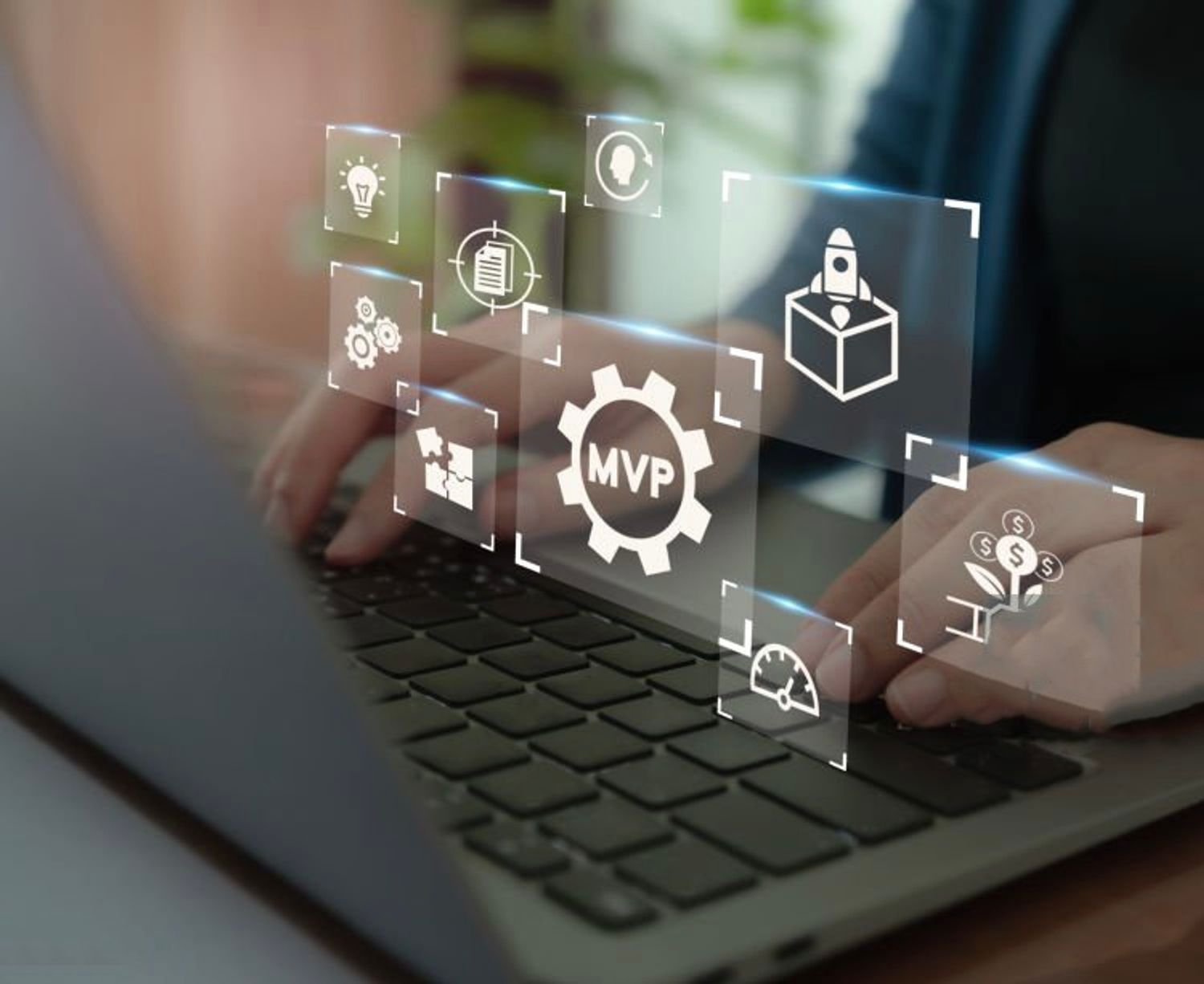 Open laptop displaying "MVP" symbol above screen, and user is using mbp development for startups
