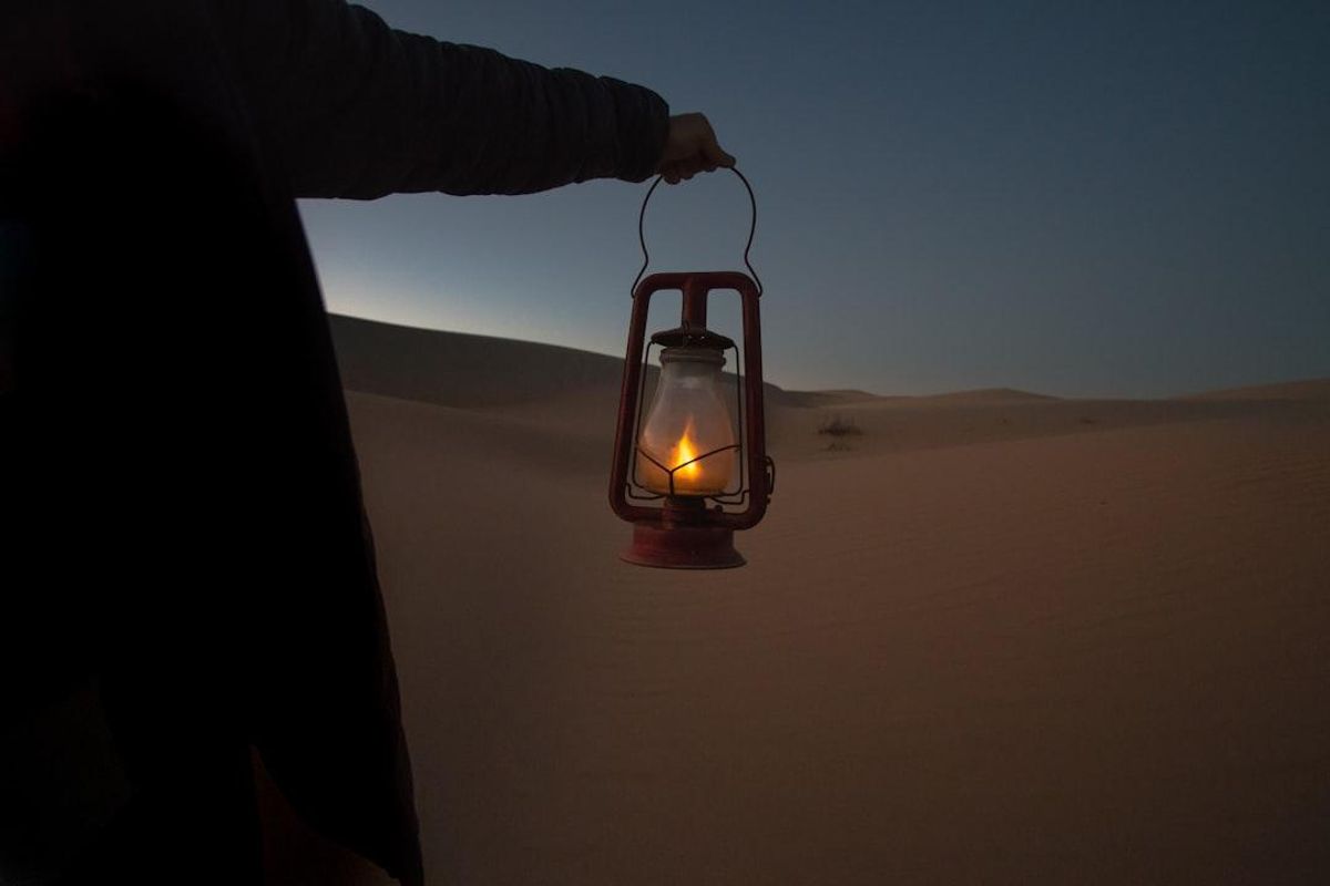 person holding lantern