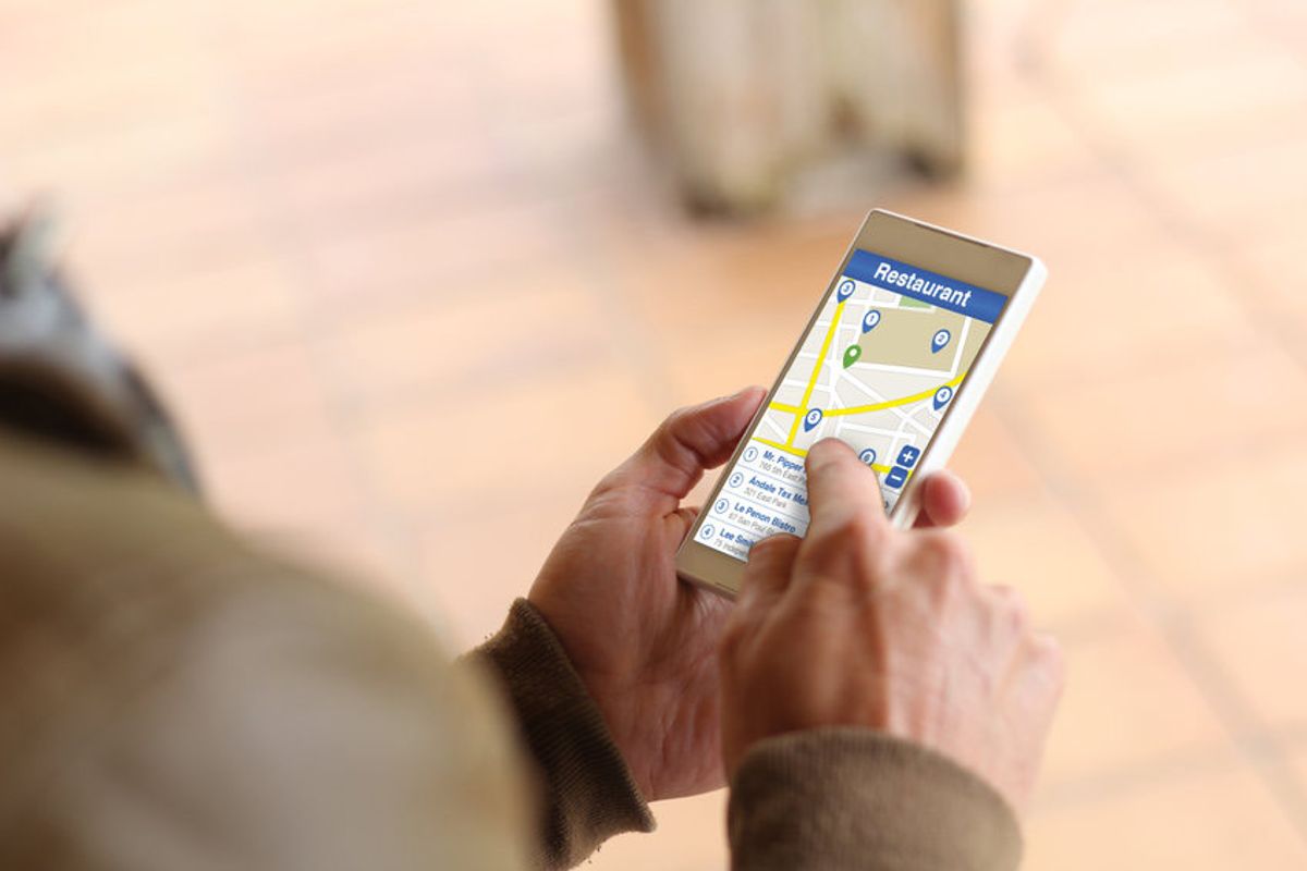 person using maps on mobile phone