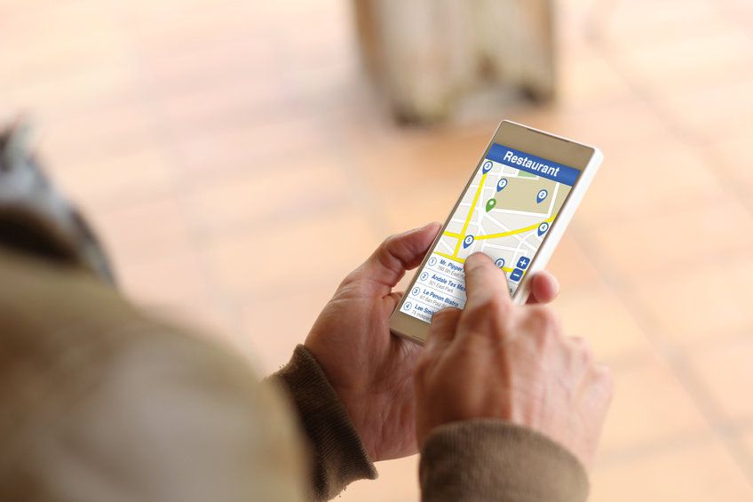 person using maps on mobile phone