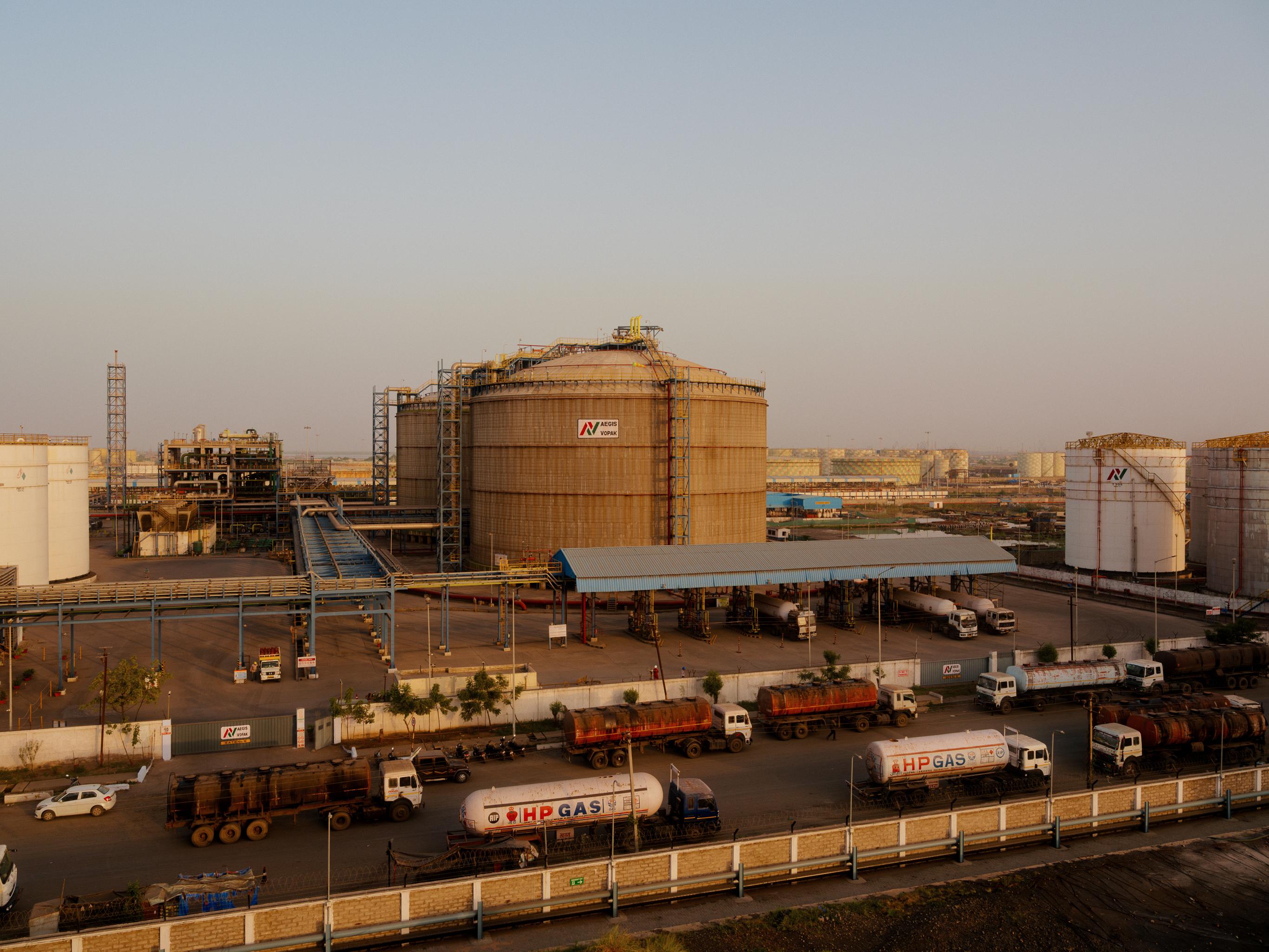 View of the Kandla terminal, showing some storage tanks with trucks in the foreground
