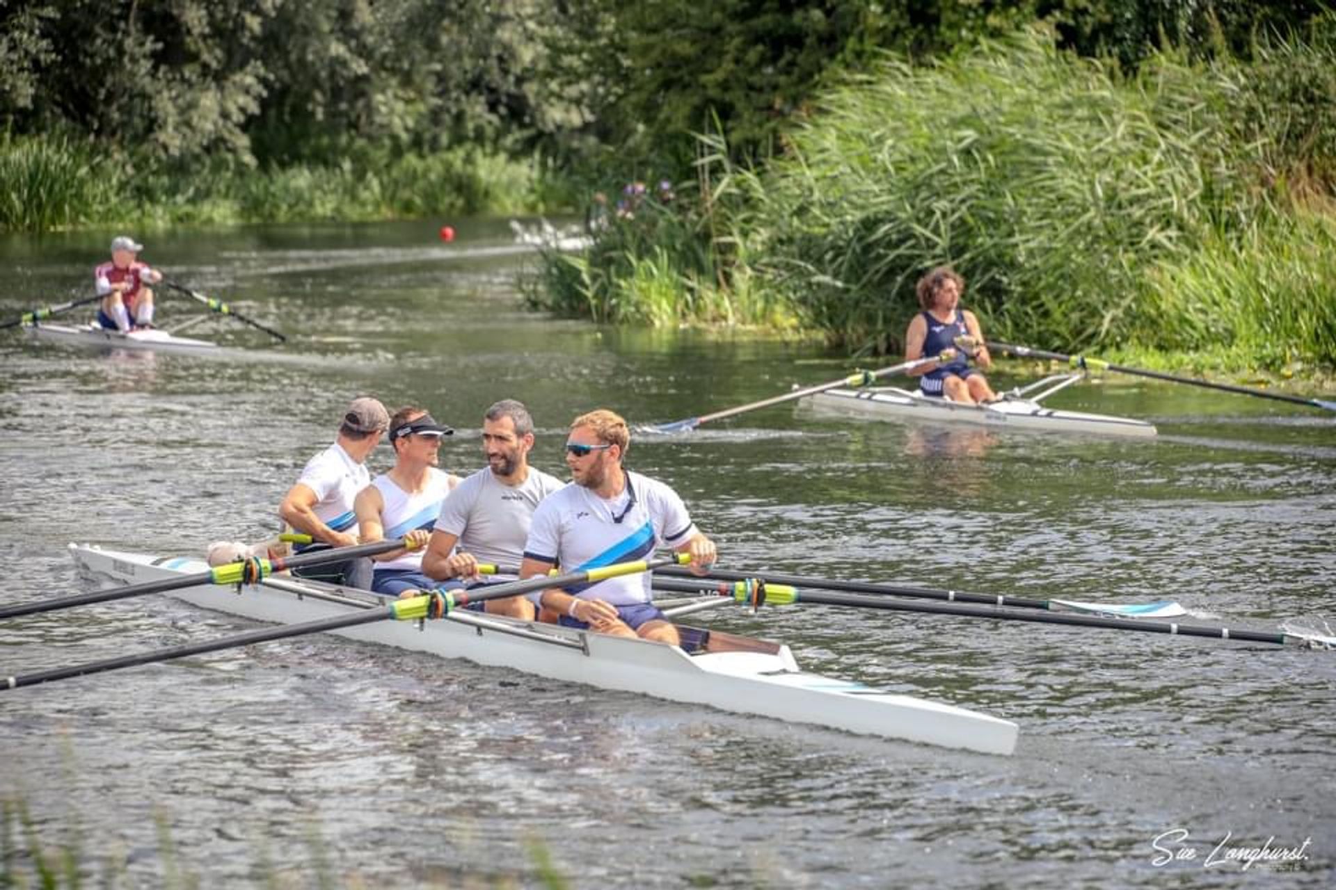 Rowers at the Sudbury Regatta make their way up to the start. 