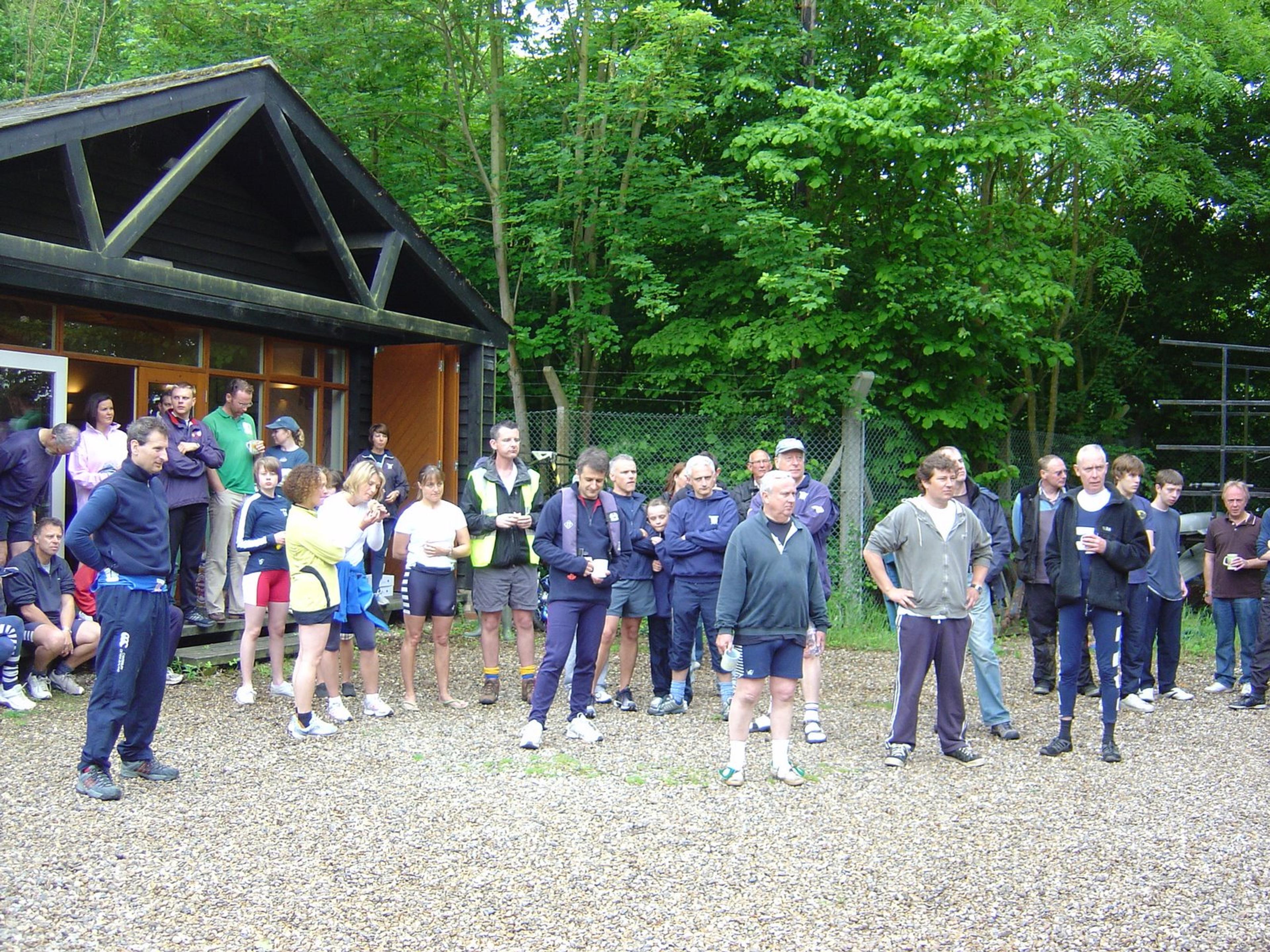 Members assemble for a briefing outside the clubhouse. 