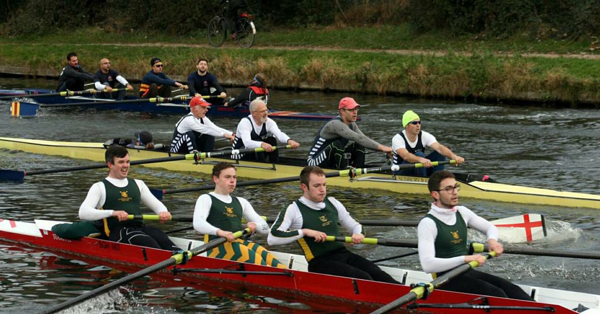 Three crews jostle for track (river?) position in expensive Stämpfli boats. Sudbury’s men’s coxed four’s in the middle of it. 