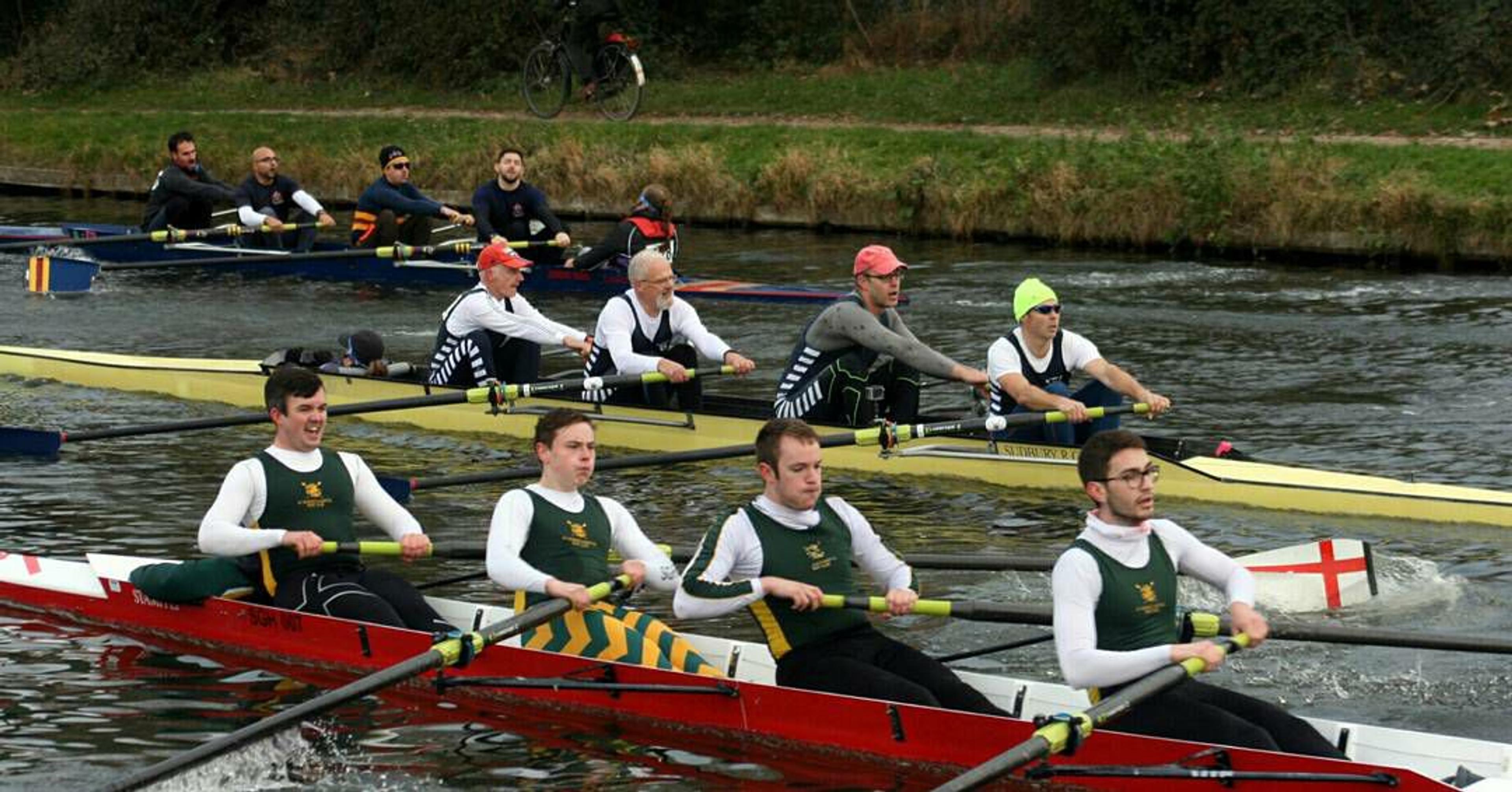Three crews jostle for track (river?) position in expensive Stämpfli boats. Sudbury’s men’s coxed four’s in the middle of it.