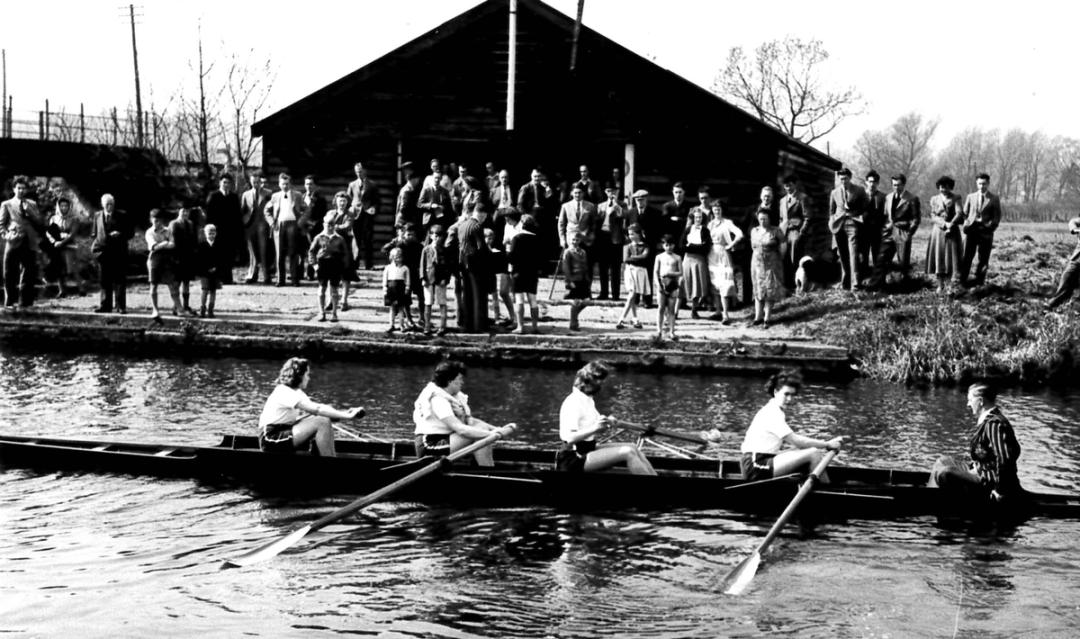 Clayton, Jay, Dormer, Hill and Chapman row past the boathouse