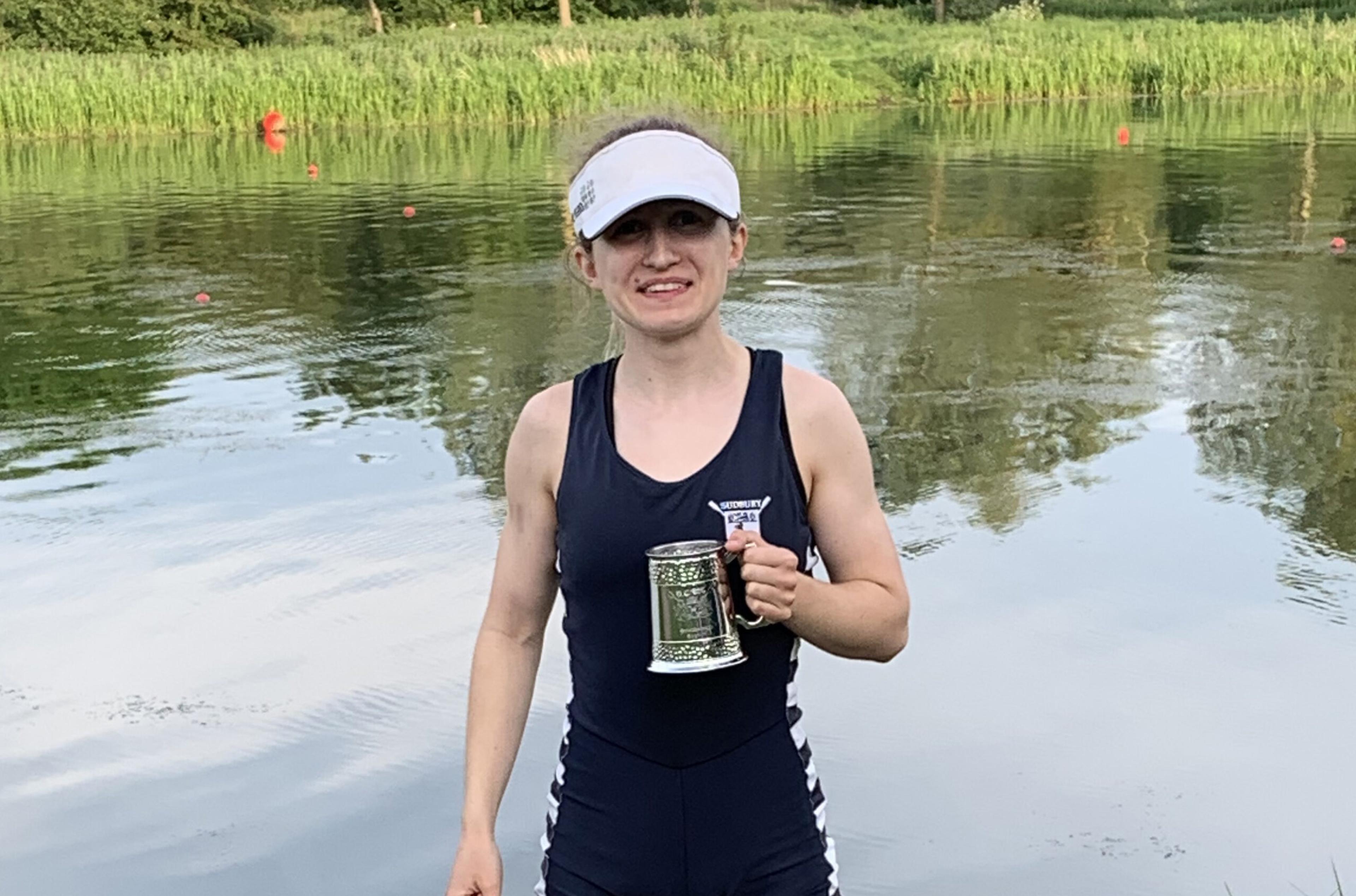 Amelia Moule holding a her pot next to the river. 