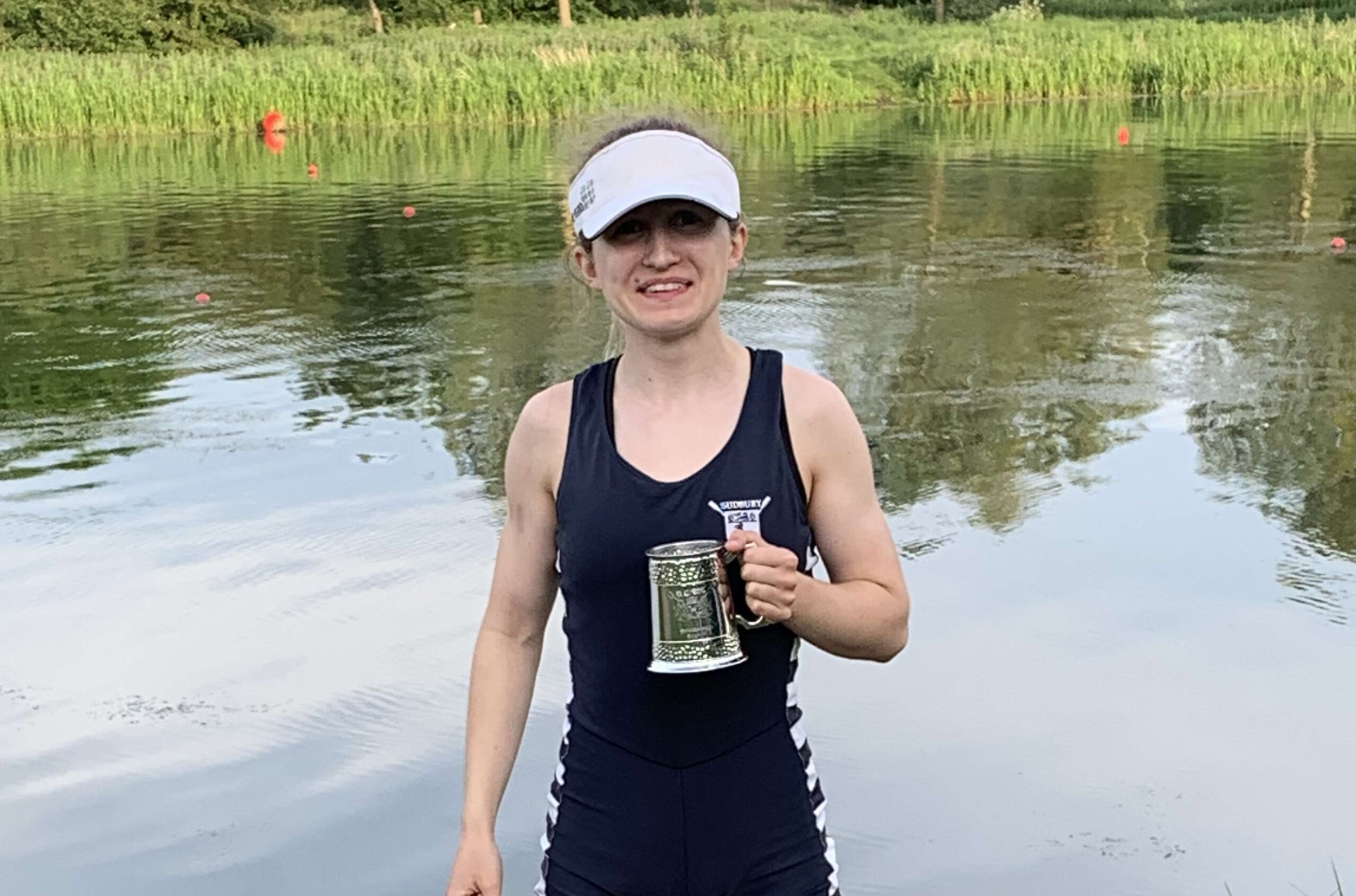 Amelia Moule holding a her pot next to the river.