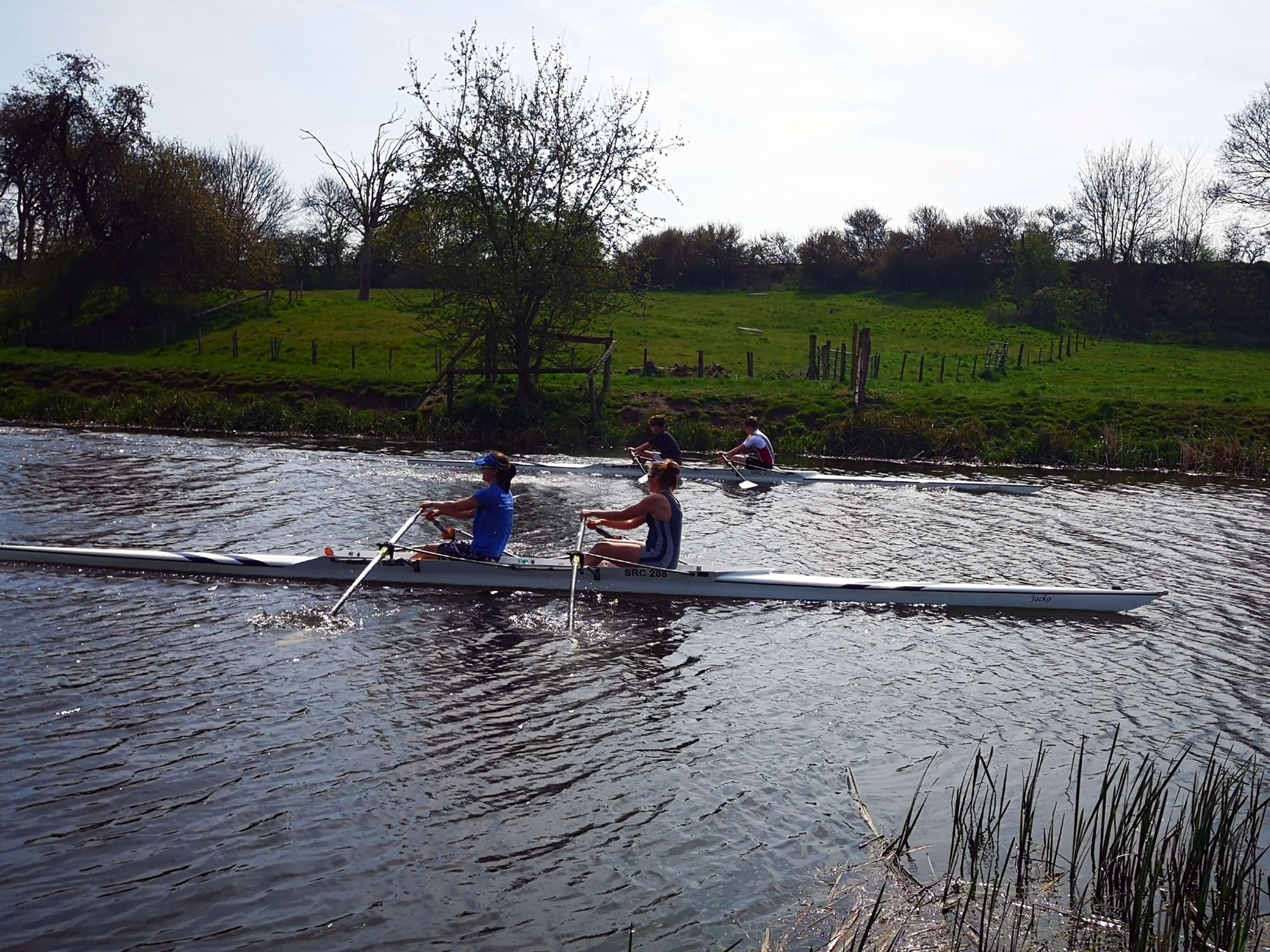 Two doubles approach the finishing post during the Good Friday opening races.