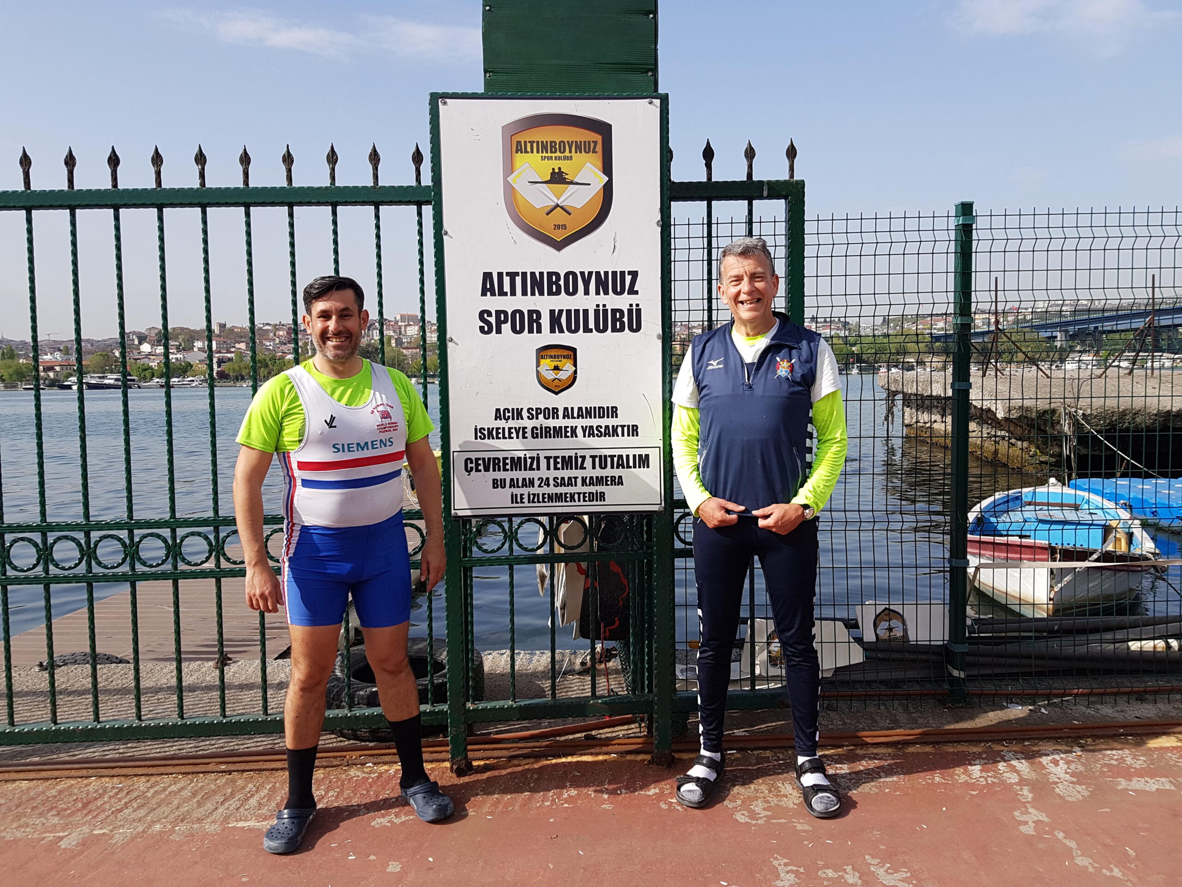 Andrew Blit and Kayhan Yalçın posing for a photo in front of a Turkish rowing club.