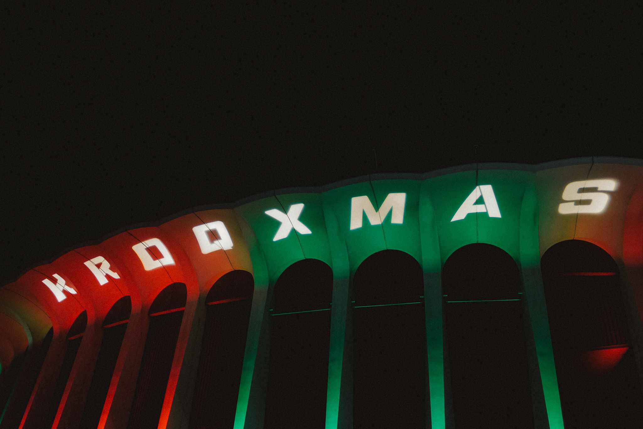 KROQ Xmas sign lit up at The Forum in red and green
