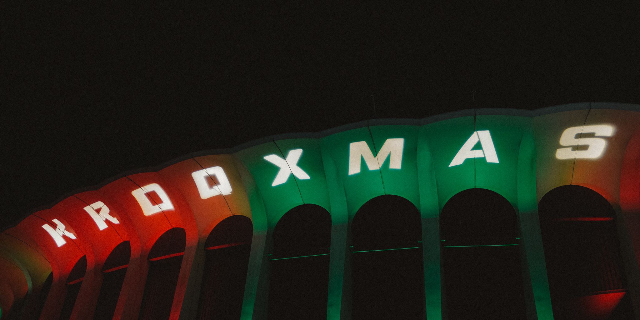 KROQ Xmas sign lit up at The Forum in red and green