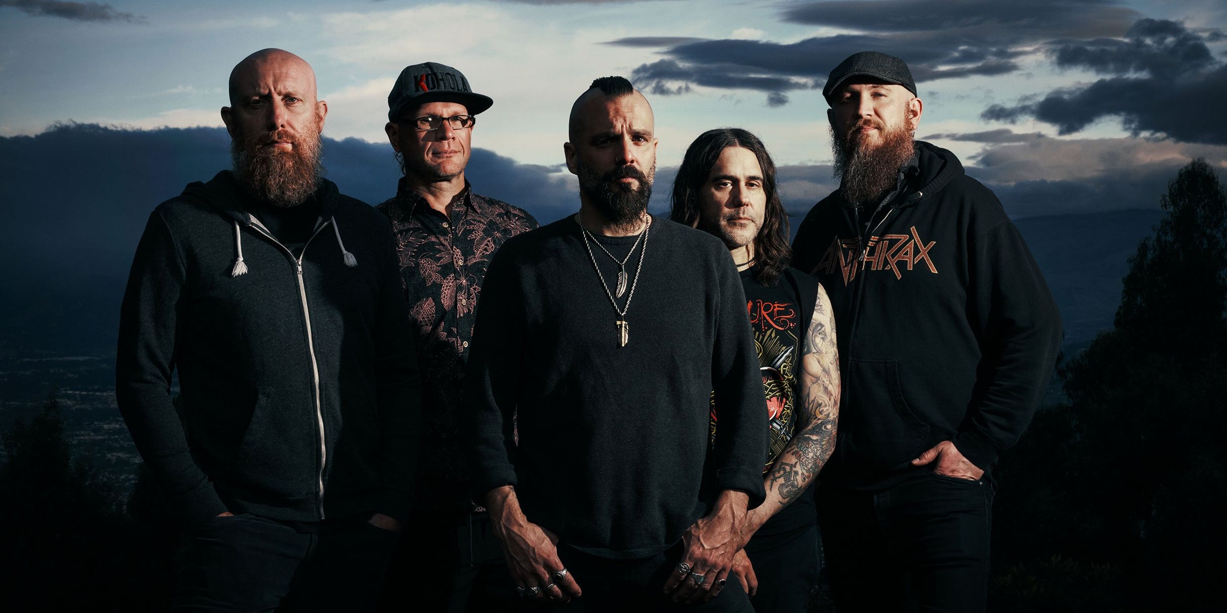 Killswitch Engage performing live on stage with dramatic lighting