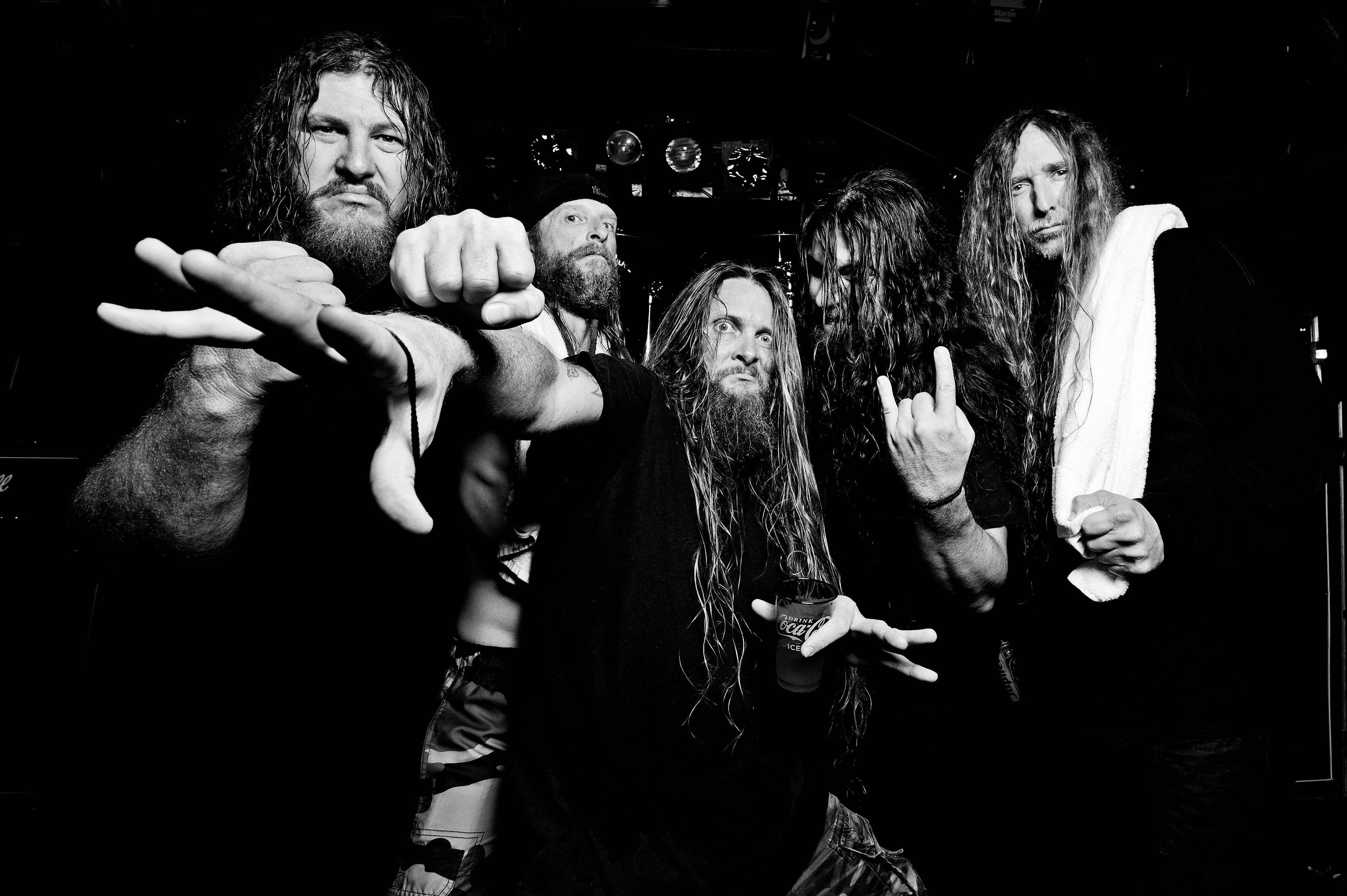 Obituary performing live on stage, death metal band from Tampa Florida