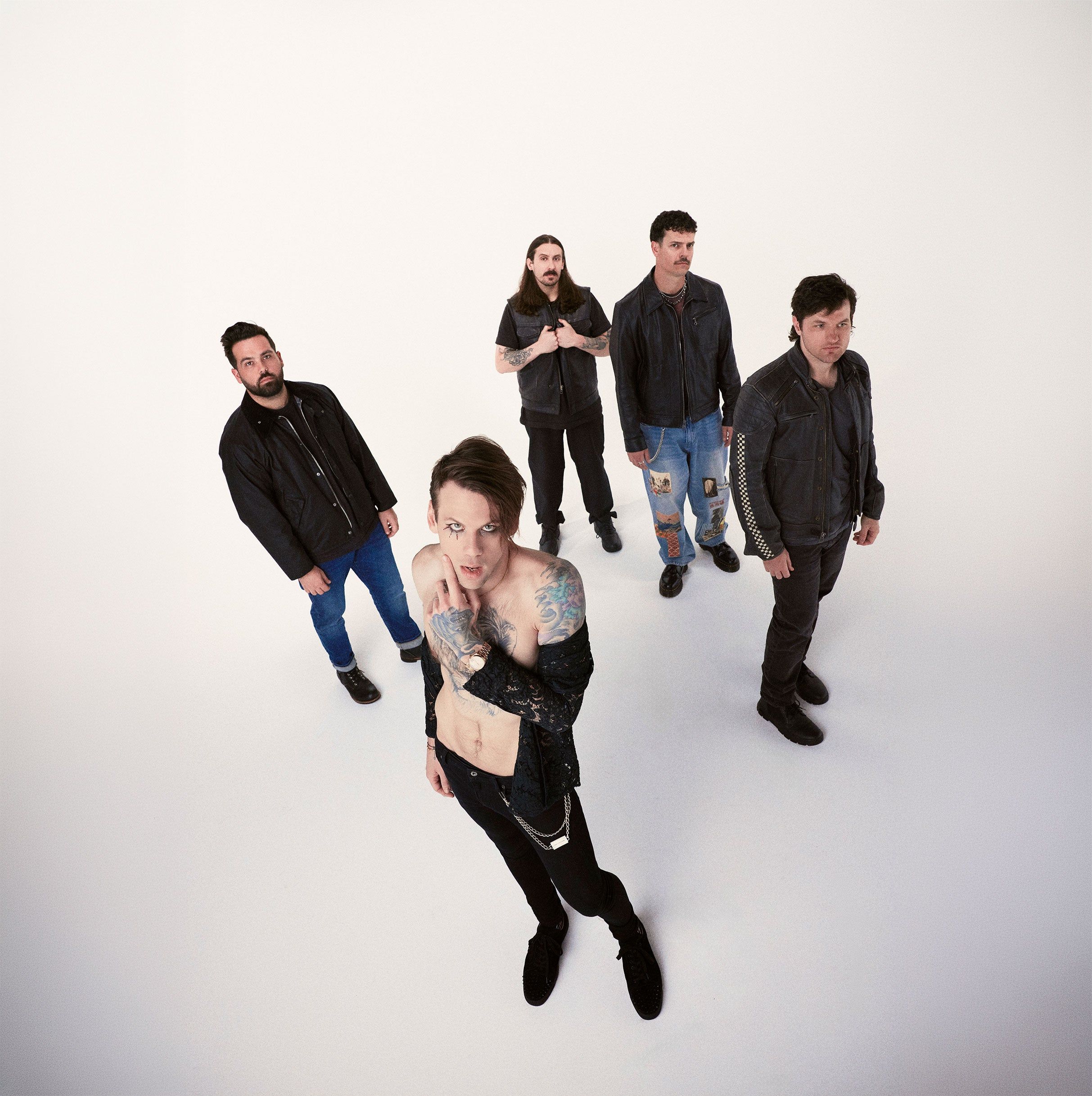 Beartooth performing live on stage with intense lighting and crowd energy