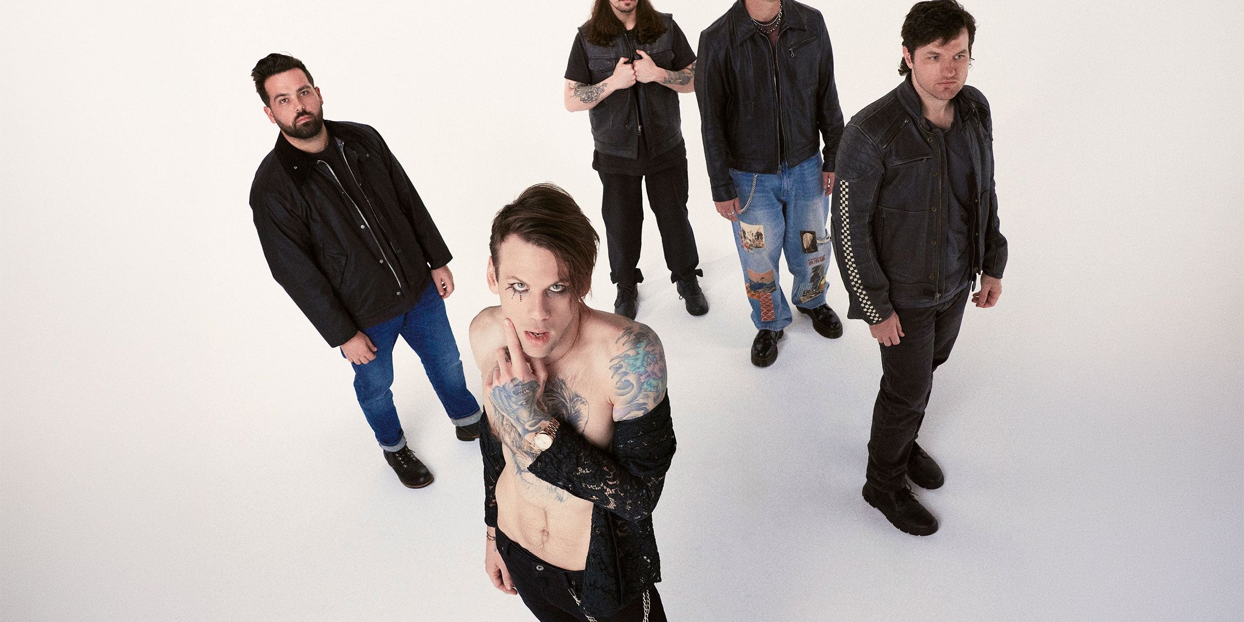 Beartooth performing live on stage with intense lighting and crowd energy