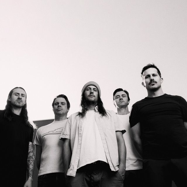 Saosin performing live on stage, post-hardcore band teasing new music in 2026