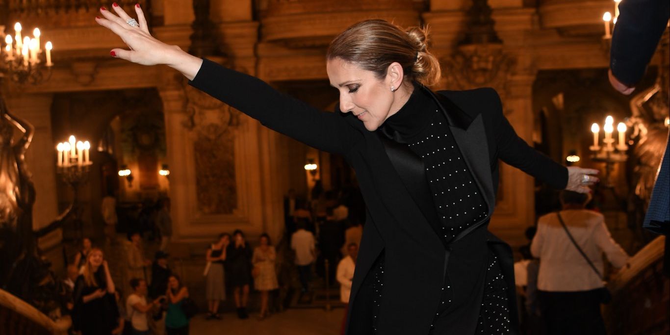 Céline Dion performing live, announcing her 2026 Paris La Défense Arena residency