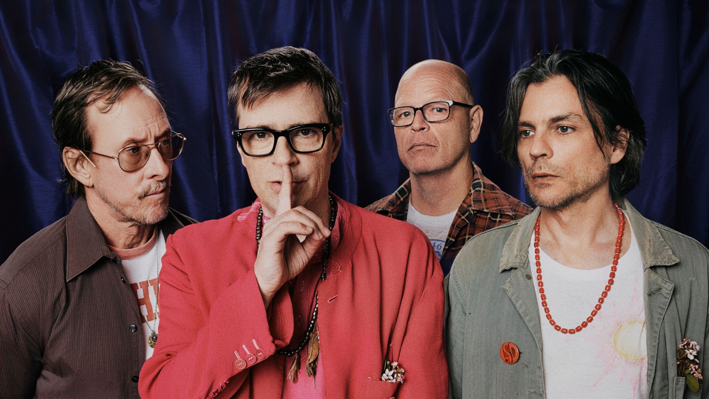 Weezer performing live on stage during their arena tour