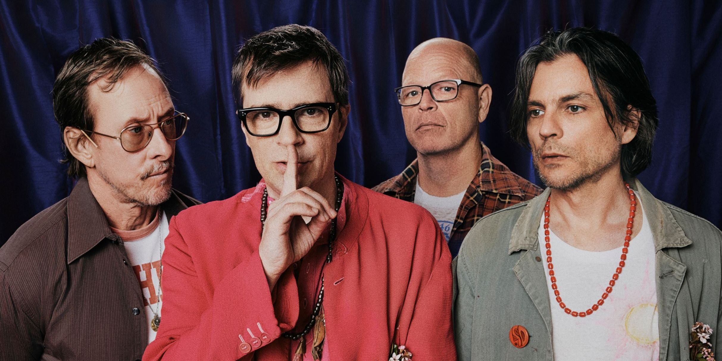 Weezer performing live on stage during their arena tour