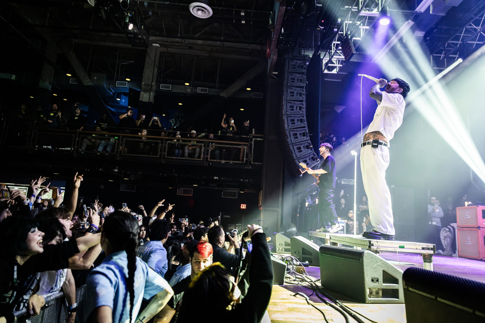 Chiodos vocalist Craig Owens performing on stage at House of Blues Anaheim with the crowd reaching up