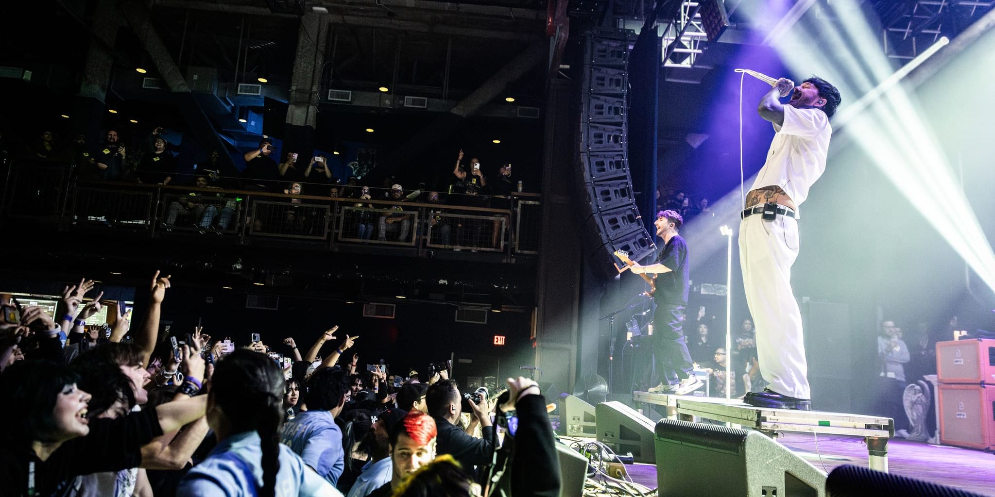 Chiodos vocalist Craig Owens performing on stage at House of Blues Anaheim with the crowd reaching up