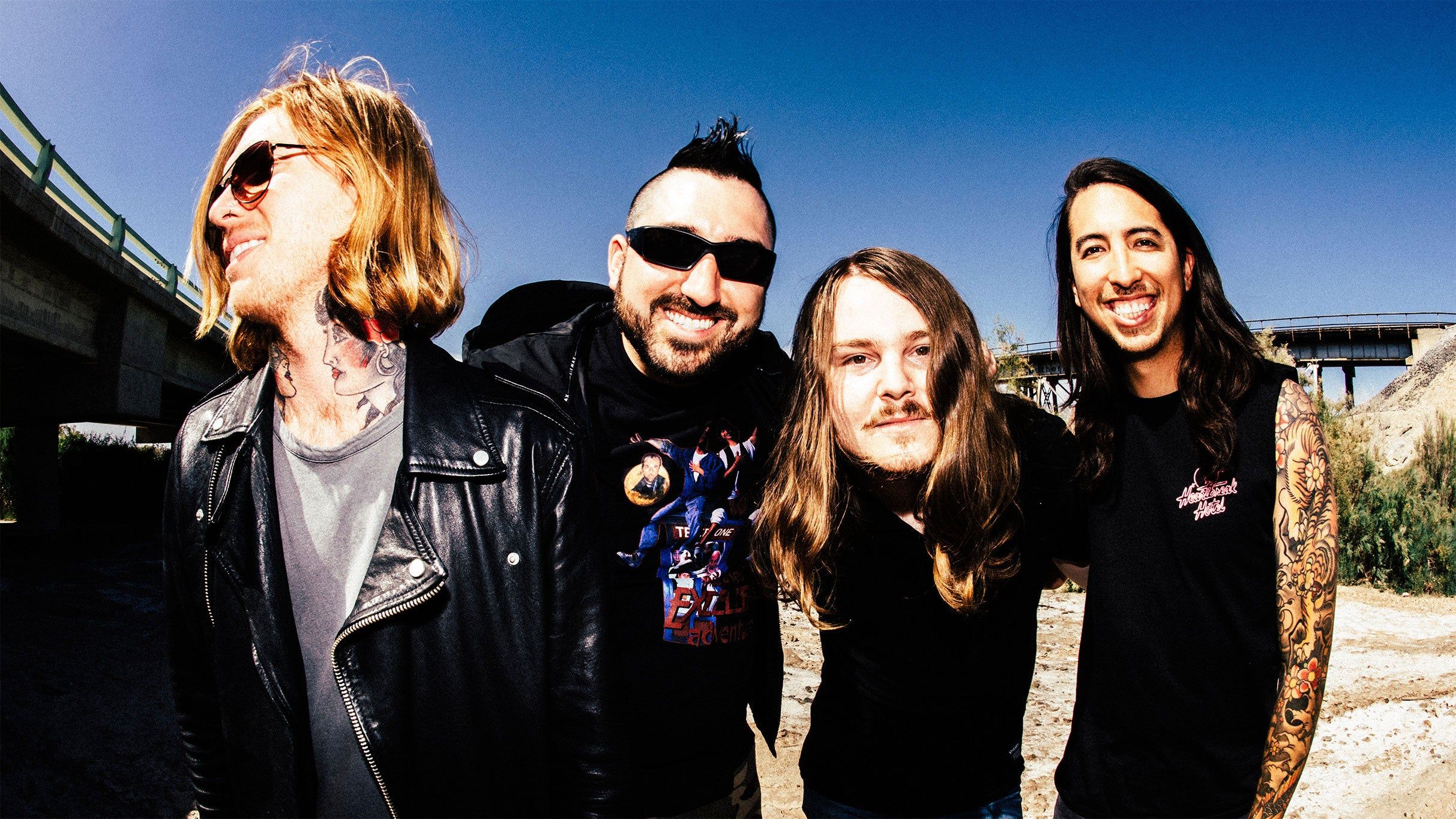 Of Mice & Men band photo under a freeway overpass
