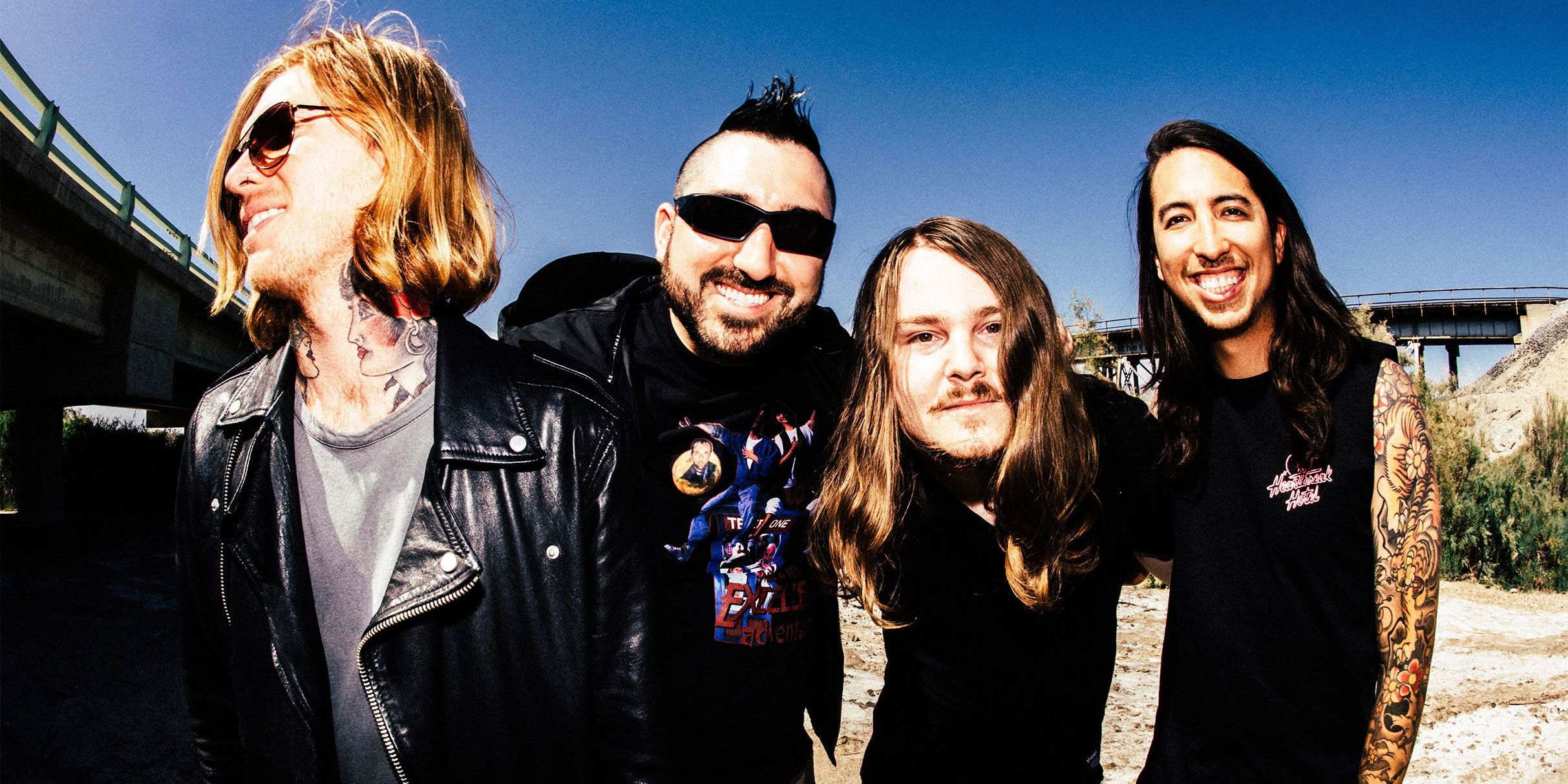 Of Mice & Men band photo under a freeway overpass