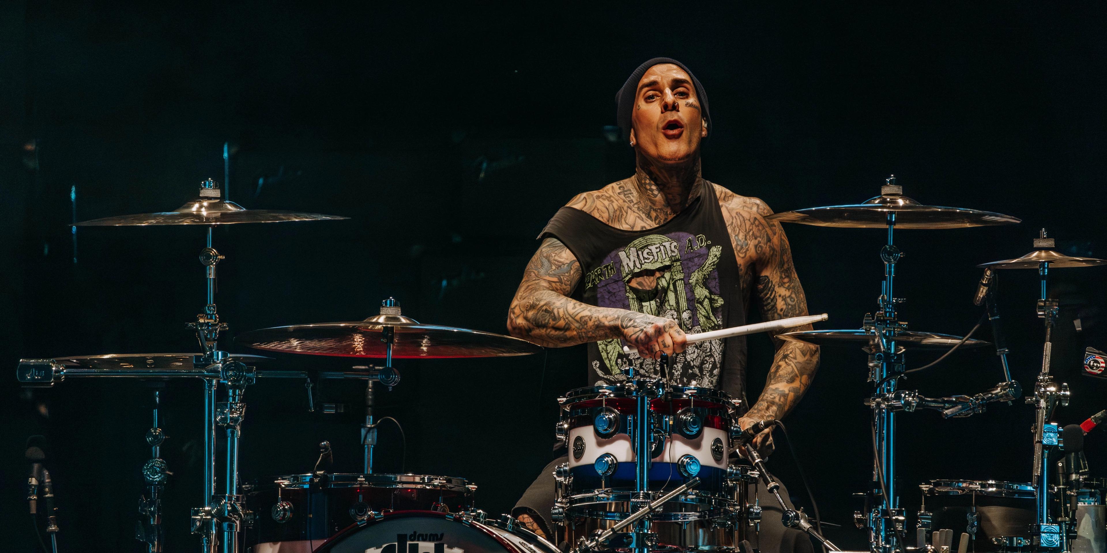 Travis Barker performing live on drums with Blink-182
