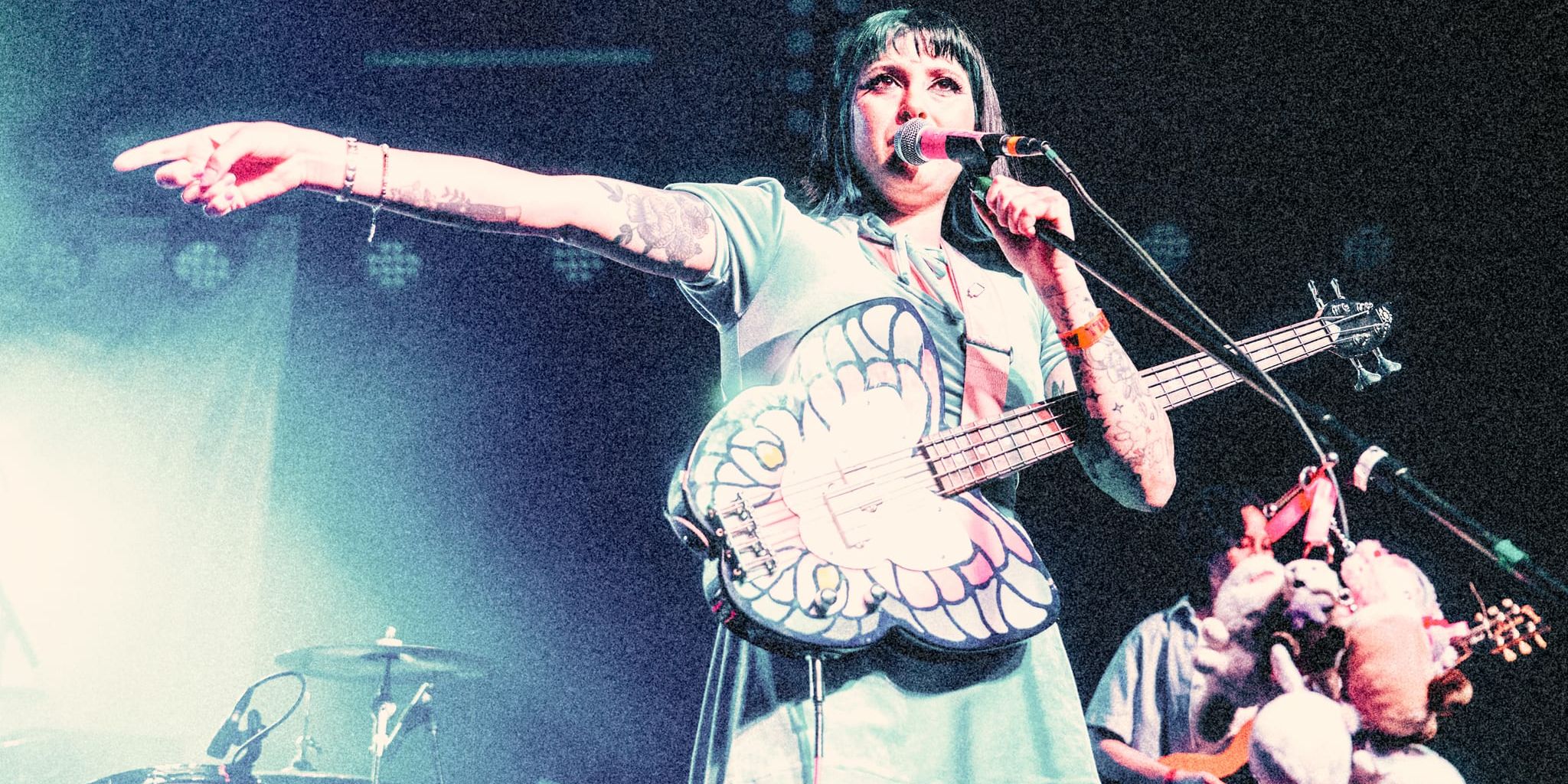 Pup delivering an energetic punk performance at The Glass House in Pomona with illuminati hotties and Suzie True