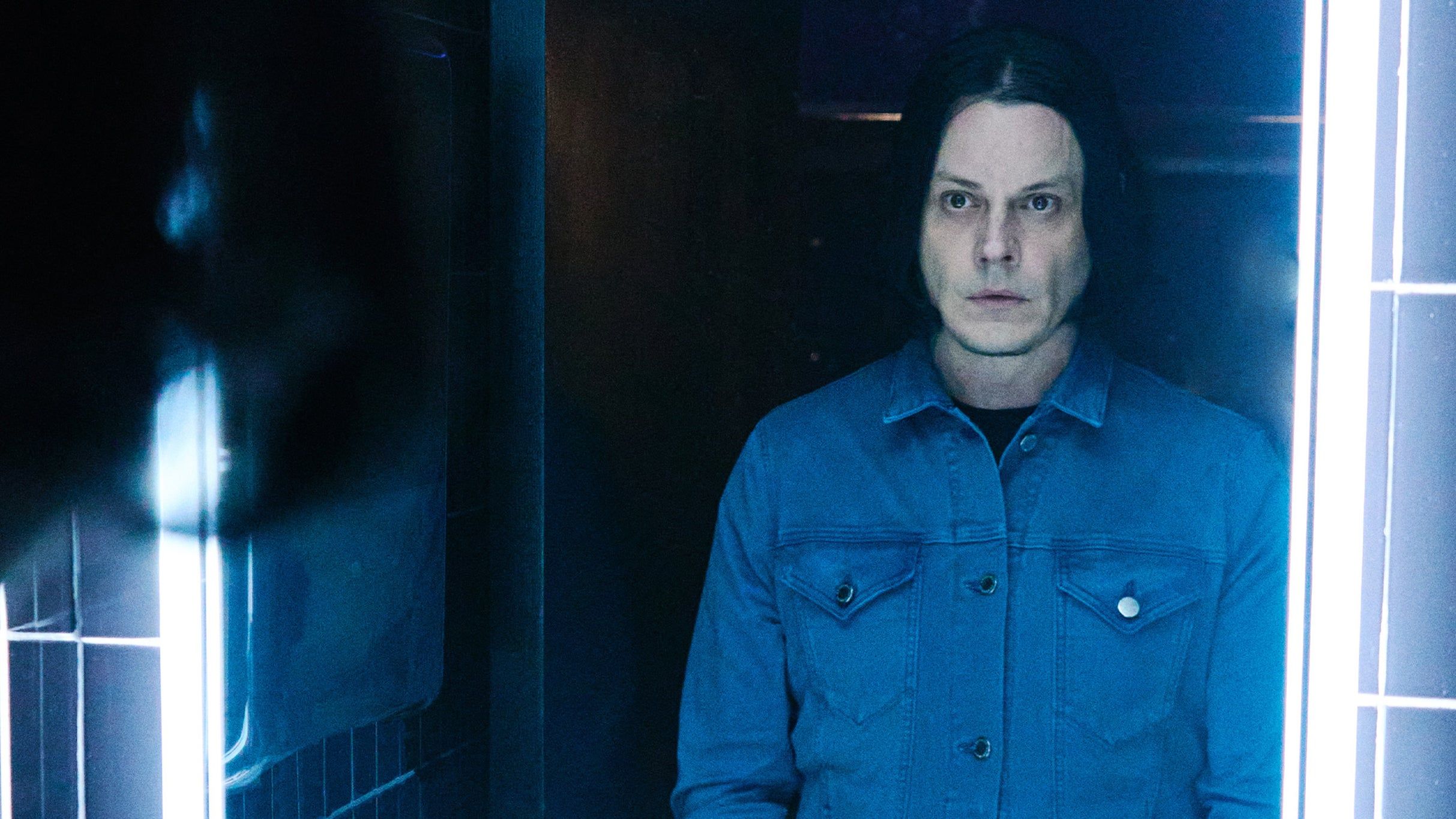 Jack White performing live on stage during a 2026 tour announcement