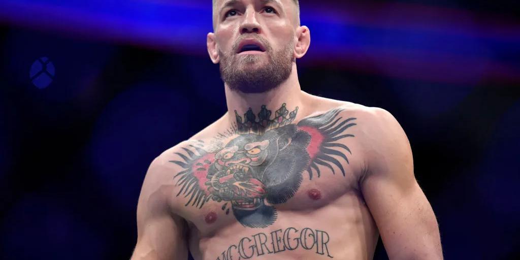 Conor McGregor preparing to fight inside the octagon at a UFC event