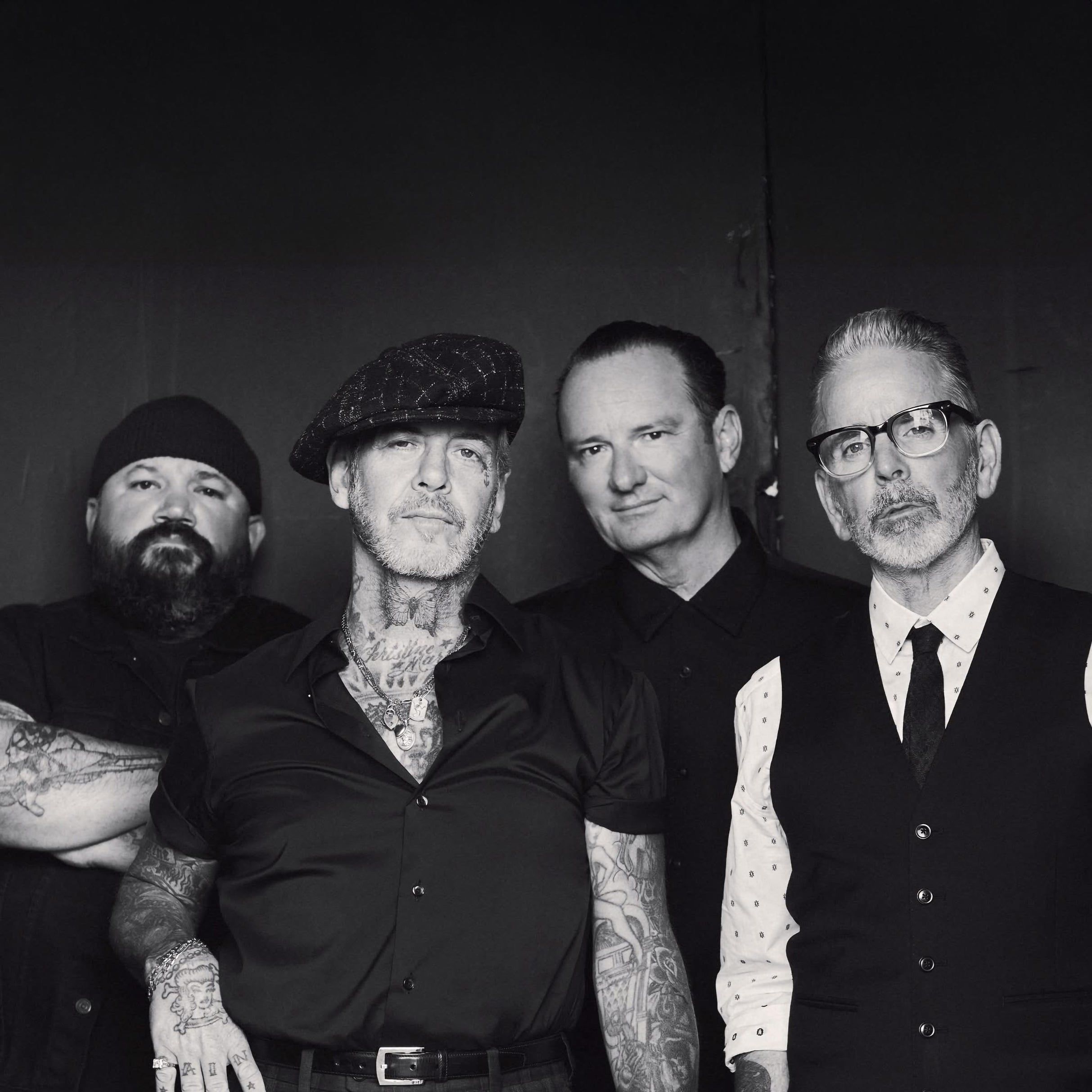 Social Distortion performing live on stage with Mike Ness on guitar and vocals