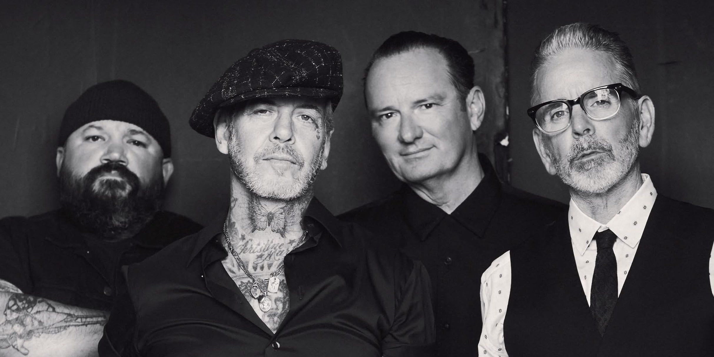 Social Distortion performing live on stage with Mike Ness on guitar and vocals