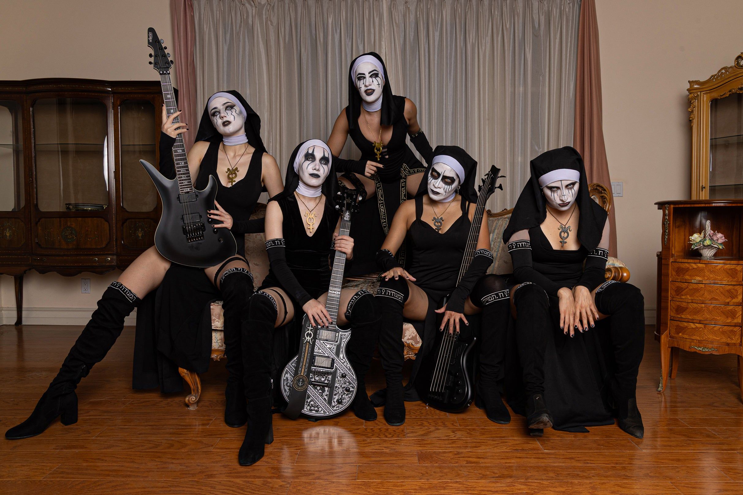 Dogma performing live on stage during a dark ritualistic concert setting