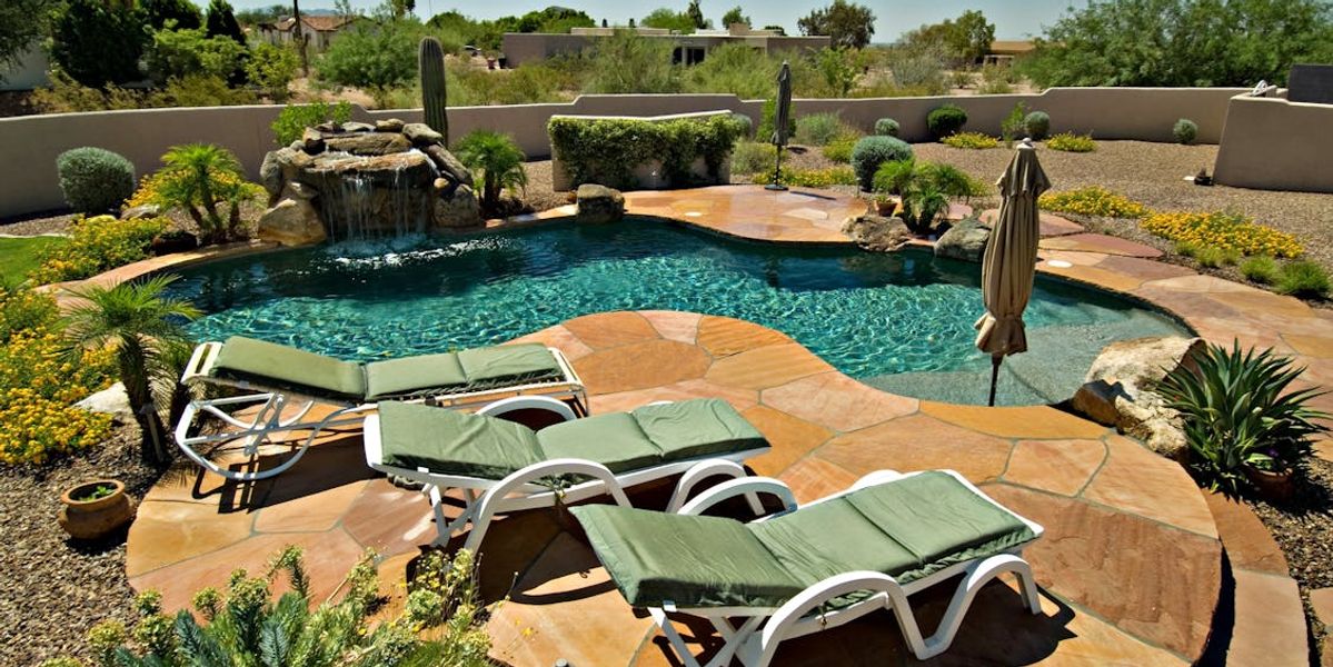 Desert Southwest home with pool in intense summer sun