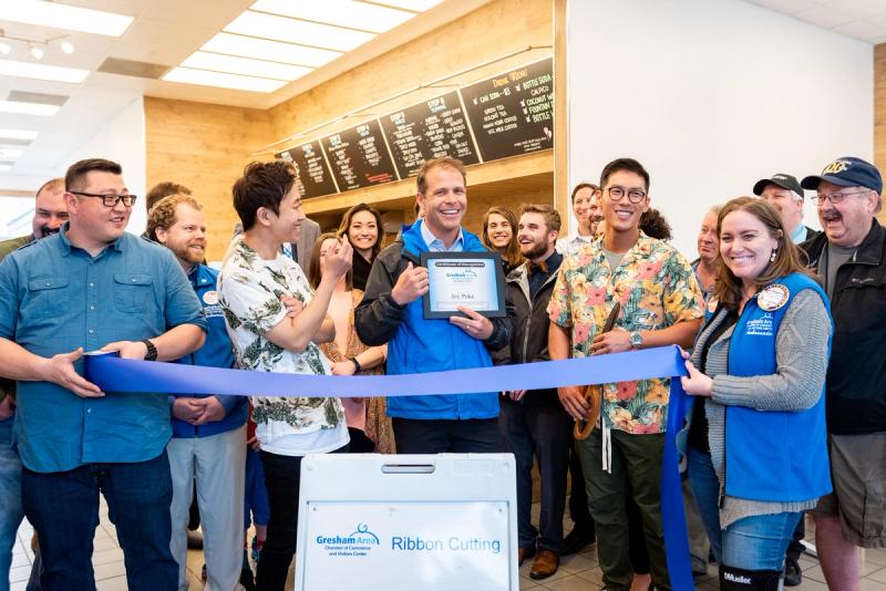 Troutdale mayor, Casey Ryan, present Joy Poke owner, Justin Hwang, with a certificate