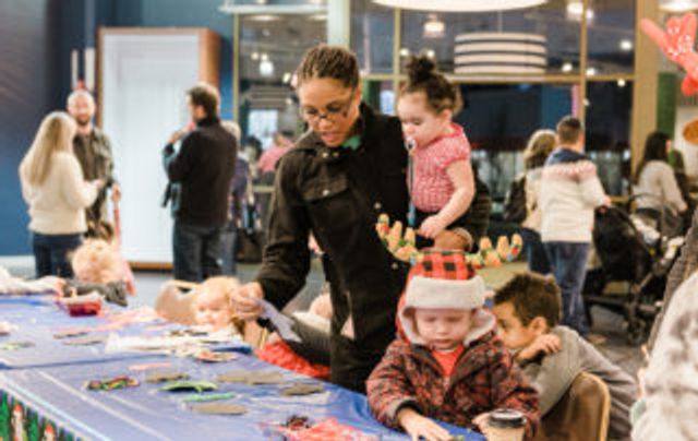 Children making crafts at Merry Mondays