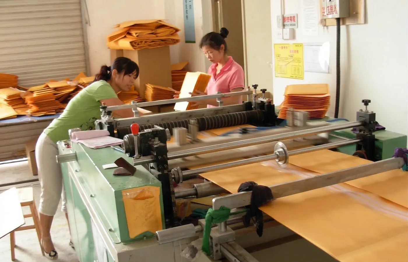 In-house quality control and precision sorting of custom printed kraft envelopes during the manufacturing process at our workshop.