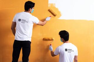 Urban Company service providers painting a wall