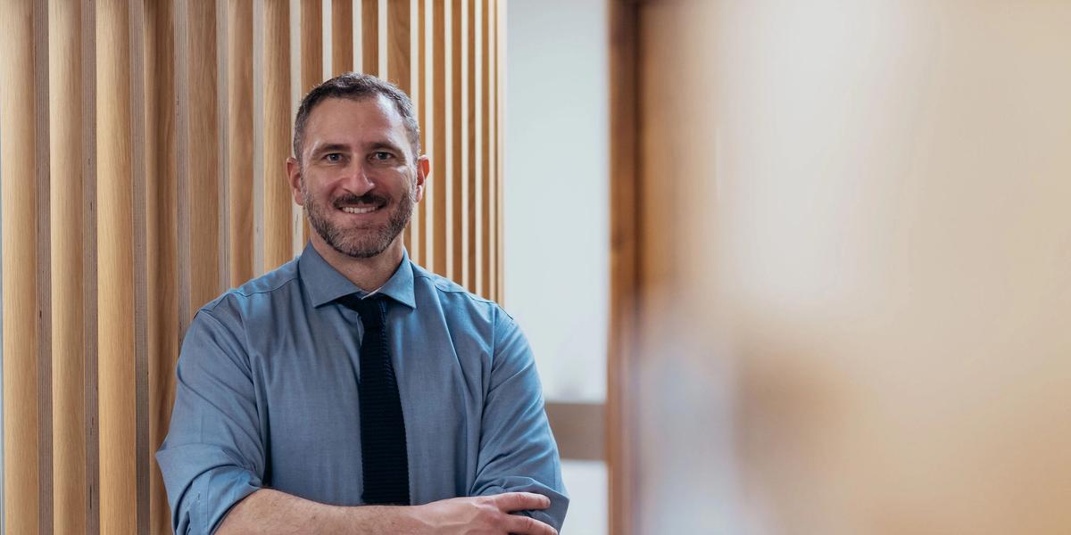 Smiling urologist awaiting patients