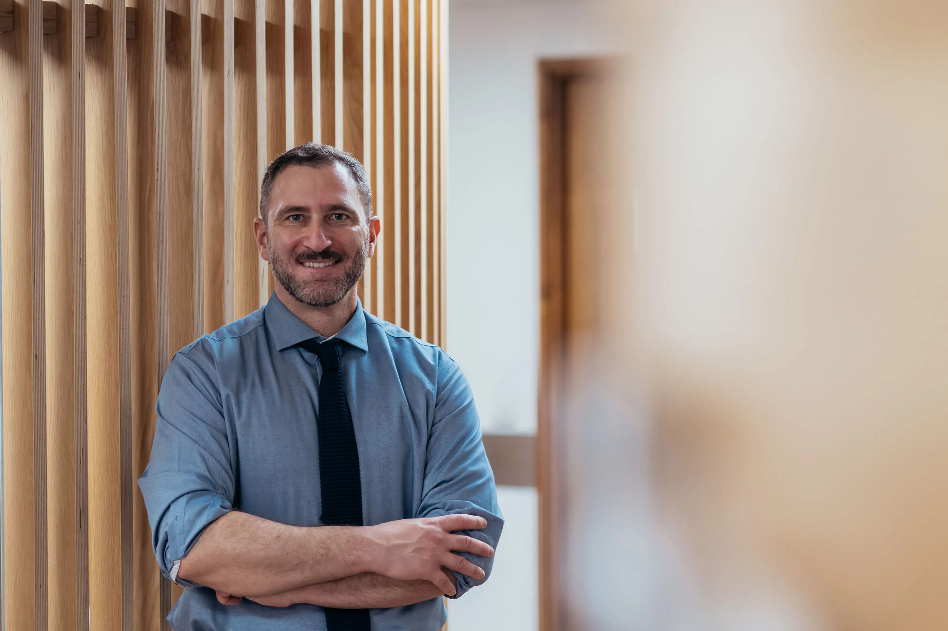 Smiling urologist awaiting patients