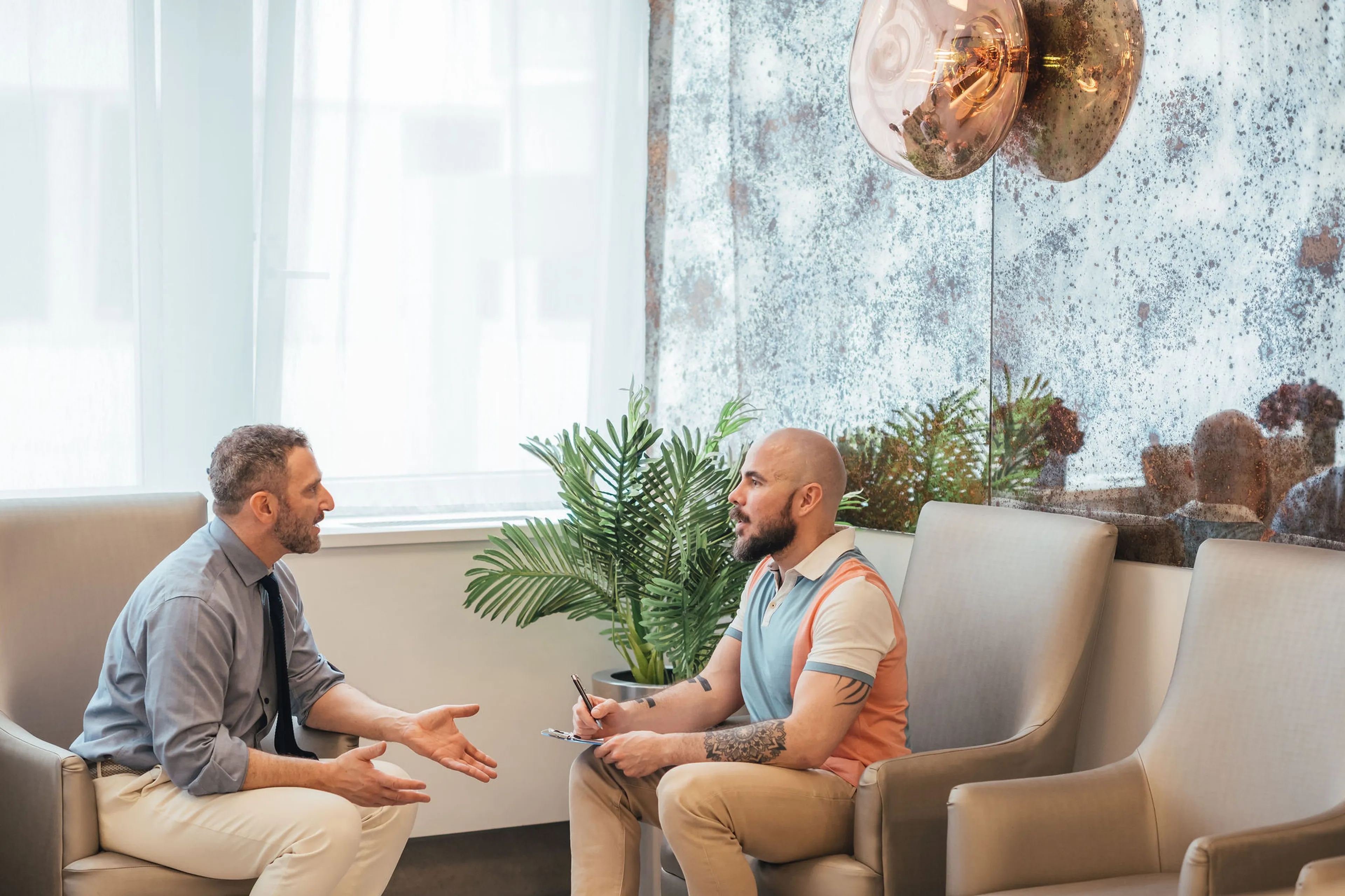 Consultant urologist discussing premature ejaculation treatment options with a patient in London