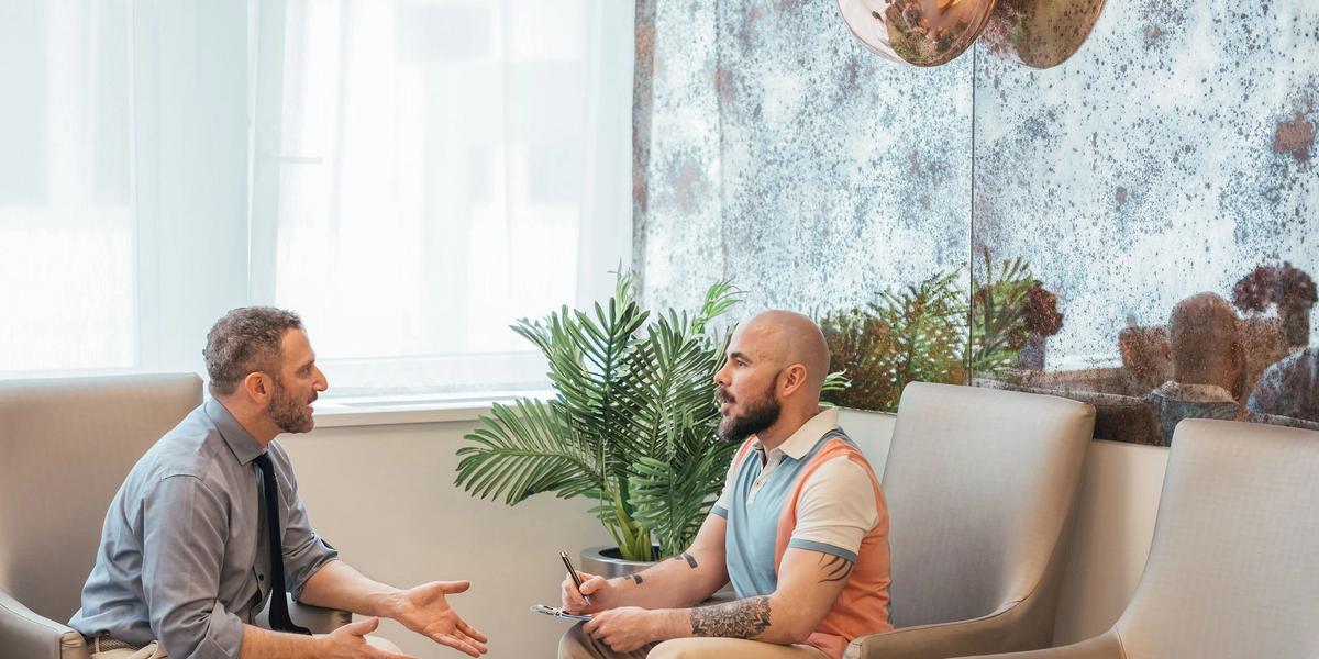 Consultant urologist discussing premature ejaculation treatment options with a patient in London