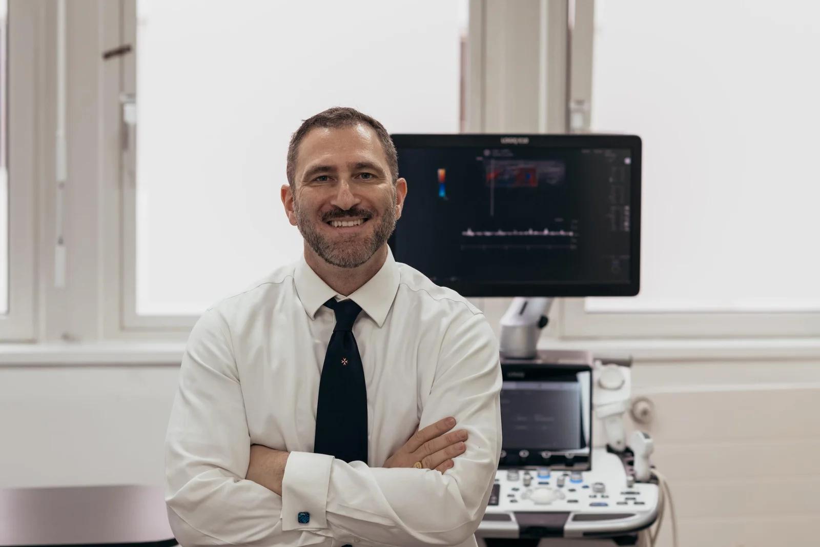 Mr Ollandini Urology Consultant and a Doppler Ultrasound machine being used in a clinical setting for diagnosis.