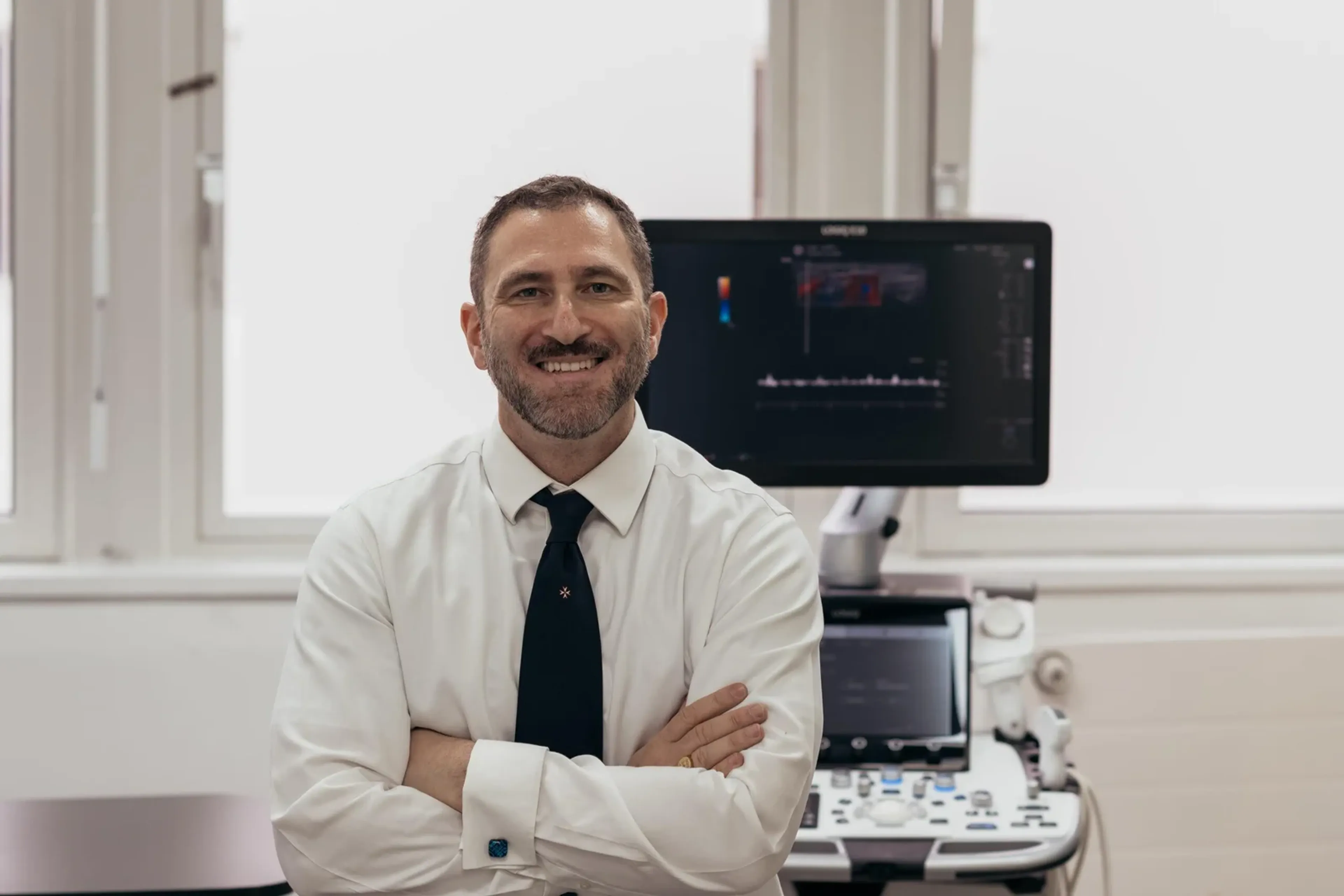 Mr Ollandini Urology Consultant and a Doppler Ultrasound machine being used in a clinical setting for diagnosis.