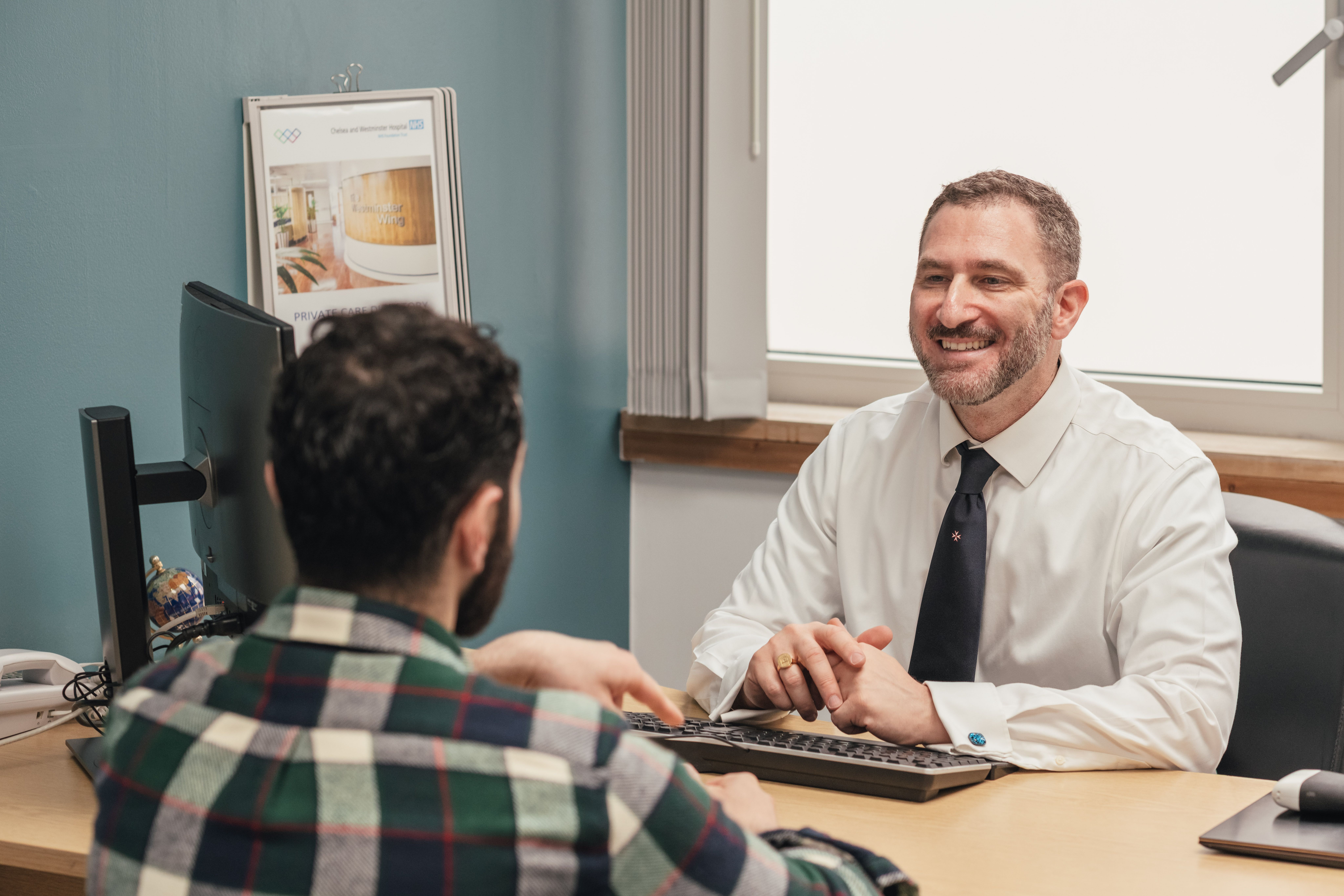 Mr. Ollandini in clinic during a consultation. 