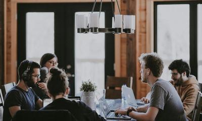 Diverse professional team collaborating in a modern global business services environment