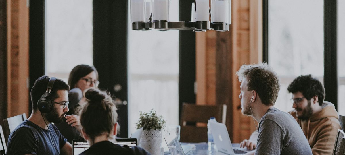 Diverse professional team collaborating in a modern global business services environment